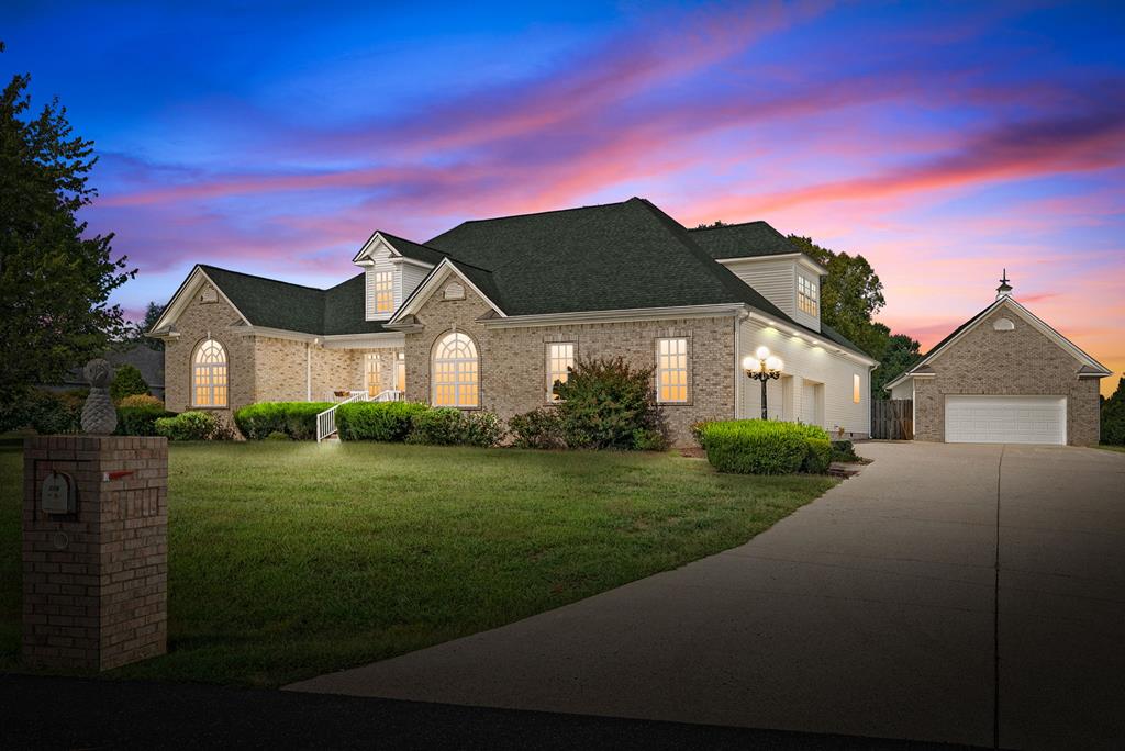 Step into luxury with this stunning executive home offering just under 4,000 sq. ft. of living space. Featuring 5 bedrooms and 4 bathrooms, this move-in ready property has been updated with beautiful new LVP flooring throughout. The open-concept kitchen flows seamlessly into the living area and includes both an eat-in kitchen and a formal dining room—perfect for everyday living and entertaining.  Upstairs, you'll find a spacious bonus area complete with a relaxing steam sauna. Car enthusiasts will love the attached 3-car garage plus an additional detached 2-car garage, providing plenty of storage and workspace.  Outside is your private retreat with a sparkling inground pool featuring new plumbing, pumps, and filters. Whether you're hosting gatherings or enjoying quiet evenings, this home has it all.  Don't miss your chance to own this incredible property—schedule your private tour today! Seller is offering a $10,000 painting allowance!