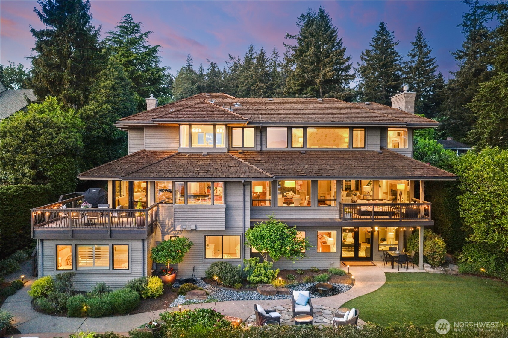 Situated in coveted Island Point and available for the first time in 20 years, this extraordinary 4,630-square-foot Mercer Island residence showcases the rare combination of views from all three levels along with a flat backyard ideal for play and entertaining. Perfectly positioned to capture dramatic views of Lake Washington, Seattle, and the Olympics, the home offers an exceptional sense of light, privacy, and connection to the PNW landscape. Thoughtfully remodeled and expanded by the current owners with quality craftsmanship, the layout blends elevated style with exceptional livability. On the main level, a chef’s kitchen with views from the kitchen sink opens seamlessly to the entertaining spaces and expansive view deck, connecting both formal and informal gathering areas ideal for everyday living and entertaining. Upstairs find two bedrooms and an office, which could be a third bedroom. The primary suite showcases views from every vantage point, including the bathtub. On the lower level find three bedrooms, two baths, and curated features including a wine cellar and rec room opening directly to the backyard with professionally designed and meticulously maintained landscaping. Pre-inspected and impeccably maintained, this move-in-ready home is within walking distance of South End shopping and dining and top-rated Mercer Island schools. It is a rare opportunity to own a legacy property in one of Mercer Island’s most desired neighborhoods.