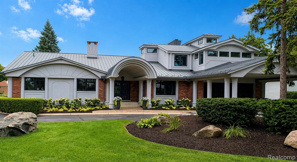 This completely renovated luxury lakefront estate presents a rare opportunity to own a turnkey home on one of Southeast Michigan’s most prestigious lakes – Lake Angelus. The residence features a thoughtfully designed floor plan that seamlessly blends the openness of modern living with distinct, private spaces for comfort and functionality. Nearly every room captures stunning, unobstructed lake views, creating a constant connection to the natural surroundings.At the heart of the home is an extraordinary great room, anchored by a striking architectural fireplace. The bright, expansive kitchen is complemented by an adjoining prep kitchen—ideal for the inspired home chef or hosting at scale. The lower level adds more versatile living space, perfect for entertaining or accommodating guests with in-law suite potential. This level also includes a dedicated fitness area, game space, theater room, and a wine cellar.Car enthusiasts and lake lovers alike will appreciate the heated four-car lower garage, perfectly suited for vehicle storage or housing lake toys. Outdoor living is equally impressive, with a massive two-level deck offering sweeping panoramic views of the water—an exceptional setting for gatherings or quiet evenings. The expansive and rare flat backyard provides ample space for recreation, complete with a basketball net and room for a variety of outdoor activities.Lake Angelus is one of the largest yet most private and exclusive lakes in Southeastern Michigan. With only 140 homes, the community offers an unparalleled sense of space and tranquility. Despite its privacy, Lake Angelus fosters a strong sense of community through optional cherished traditions such as the annual pig roast, Fourth of July fireworks, fishing tournament, and annual golf outing.Opportunities to own on Lake Angelus are exceedingly rare. This is a truly exceptional offering combining luxury, privacy, and lifestyle in one of the region’s most coveted lakefront communities.