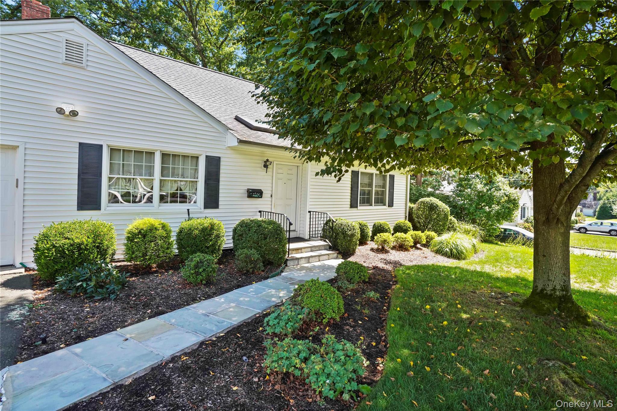 Lovely Cape Cod Home in the Sought After Ardsley School District! Located on a quiet street in the Village of Ardsley, this classic cape offers the perfect blend of charm, comfort and functionality; just minutes from local shops, dining, and schools. The main level features a formal living room and brightly lit kitchen that flows seamlessly into the dining area and out to a spacious deck, creating the perfect indoor-outdoor set up for everyday living and casual gatherings. A primary bedroom with a full ensuite bathroom and a second bedroom plus full hall bath complete the first floor, making it ideal for one-level living or hosting guests with ease. Upstairs, you’ll find two generously sized bedrooms and a third full bathroom, providing additional space for family, guests, or private home office. The full basement offers abundant storage and future potential, while the well-maintained yard and large deck make outdoor living and entertaining a breeze. With its smart layout, inviting spaces, and prime location, this home is a true gem in the heart of Ardsley. Don’t miss this opportunity!