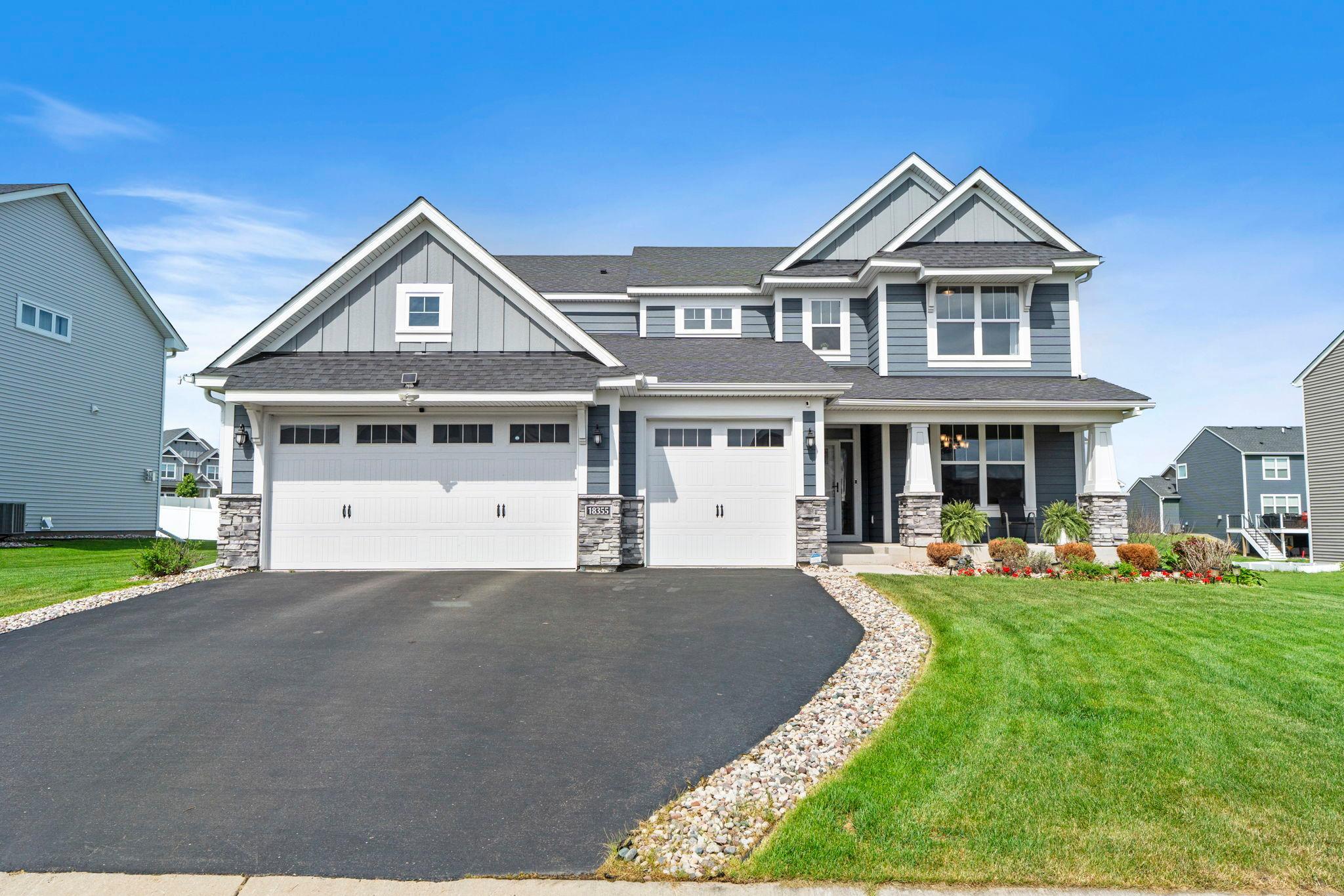 Built in 2020 and well-maintained by its original owners, this exceptional Lennar home offers the perfect blend of modern construction, completed upgrades, and true move-in readiness. Unlike new construction, the work is already done, featuring a beautifully finished lower level (2024), maintenance-free deck (2024), professional landscaping, and an established neighborhood setting.The inviting main level showcases a bright living room with a stunning stone-surround gas fireplace, kitchen with stainless steel appliances, soft-close cabinetry, walk-in pantry, large center island, and both formal and informal dining spaces designed for effortless entertaining.A main-level bedroom with walk-in closet and adjacent full bath provides flexible space for guests, a home office, or residents, while the spacious mudroom and attached three-car garage add everyday convenience.Upstairs, a versatile landing anchors four bedrooms, including a spacious primary suite with dual walk-in closets and spa-like full bath. Another bedroom with private ensuite, two additional bedrooms connected by a Jack-and-Jill bath, and a laundry room with sink complete the upper level.The recently finished lower level expands the home with a large family room, wet bar, sixth bedroom, ¾ bath, and a bonus room ideal for an office, fitness space, or hobby room.Outside, enjoy the low-maintenance deck and expansive backyard. Located in the highly sought-after Lakeville School District with access to parks, community clubhouse, and nearby recreation, this home offers exceptional space, comfort, and value across all three finished levels.