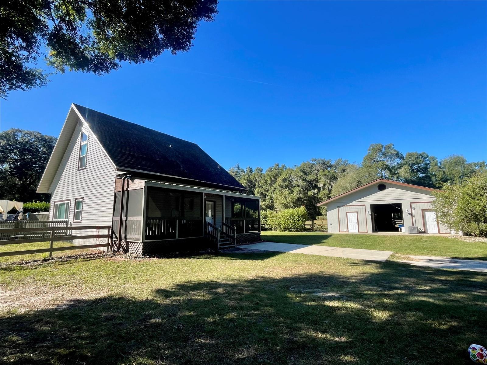 Great property now for sale in NW Ocala  A1/Zone “X” in highly desirable Meadow Wood Farms!  A big 4.4 Acre beauty with privacy fencing and gated entrance.  New 4 board and no-climb fenced, Hurricane proof cement block barn is 2900 soft with AC Tack/sitting room/office, hay and feed room and wash rack!  6-14x12 cement stalls including auto water, fans, fly system throughout, grass field for jump or dressage, 4 runouts and 2 pastures. 1-50 Amp RV hook up fenced with its own septic and water.  New Well Pump 2024.  Newer Roof 2021, AC 2019, 2024 Well Pump, New Windows 2021. Home and Barn/Roof Professionally painted.   Newly Pumped Septic tank, Generator Hook up, all make this  a great investment/1st time home owner with beautiful level paddocks and the to die for barn.  This one is ready to go bring your horses or your RV and enjoy the summer under the shade.  After a long day, walk out the sliding glass doors and relax in the above ground pool with surrounding freshly painted wooden deck, w/updated shade sails and new sand filter/pump along with a new vacuum.  While the barn is important this 2 story 2/2  with a Florida Room (make it an extra bedroom or office) is updated and makes a perfect nesting home for the Equestrian Enthusiast.  Adorably designed A-Frame could easily be an AirBnB or make it your “stay” while showing during the nearly year round show circuits.  Easy In and Easy Out to W328 just minutes to WEC/HITS/OBS and a short drive to the Horse Park or the Florida Greenways!  This one checks all the boxes and is a wonderful opportunity to be in Ocala The Horse Capital of the World.  Call for a showing appointment we don’t think this one will stay on the market long.