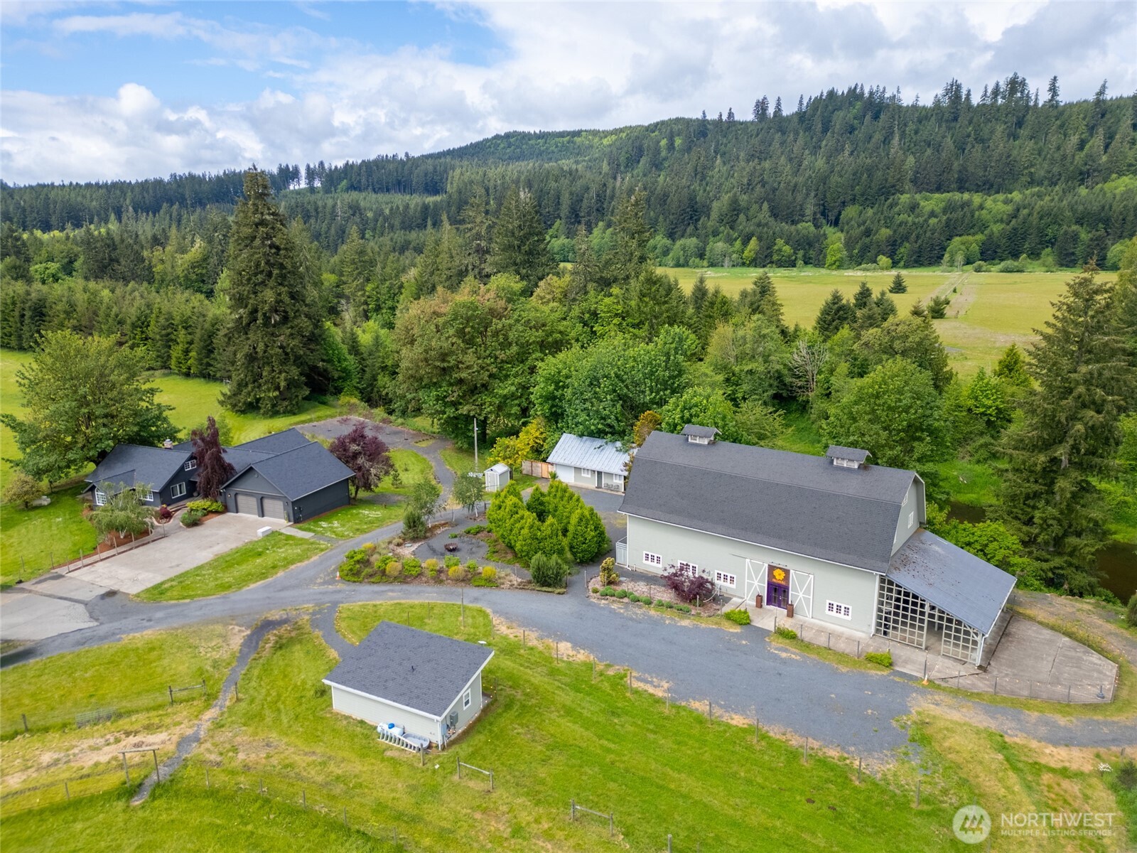 Fully remodeled 5-bedroom, 3-bath home on 40+ acres along the Chehalis River! This incredible property features a spacious deck, greenhouse, caretaker quarters and the Olive & Owl Event Center—equipped with a full commercial kitchen, stylish dining room, commercial bathrooms, and luxurious bride and groom suites. Ideal for both private living and business, the estate offers stunning natural beauty, income potential, and modern updates throughout. A rare opportunity to own a turnkey home and event venue in a breathtaking riverside setting!