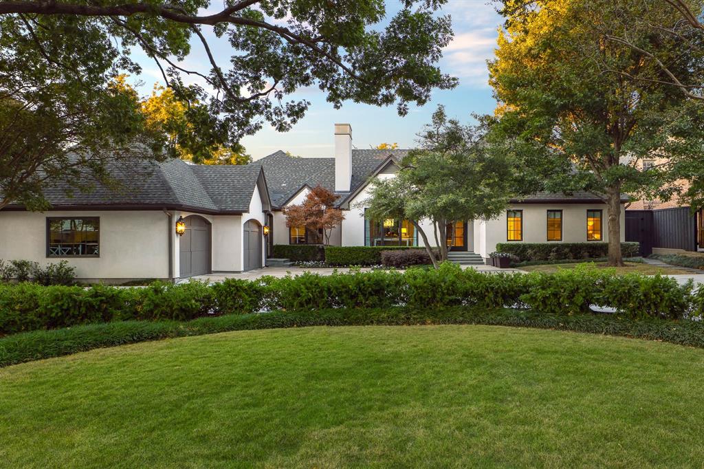 Experience a rare offering in the heart of Preston Hollow, set on an oversized interior lot that provides exceptional privacy. Reimagined in 2022 by David Stocker of SHM Architects and Gonzalo Bueno of Ten Plus Three, and expertly built by Knox Built of Tatum Brown Custom Homes, this one-of-a-kind residence blends architectural excellence with elevated design.Spanning 6,184 square feet on a single level and situated on a 0.459-acre lot, the home showcases extensive customization, state-of-the-art technology, and refined designer finishes throughout. The Eggersmann kitchen anchors the home with Gaggenau appliances, custom cabinetry, a hidden wet bar and an inviting breakfast area. A fully equipped butler’s pantry adds two Wolf ovens, a dishwasher, Scotsman sonic ice maker, and wine refrigerator.The primary suite is a private retreat featuring a lounge area, spa-inspired bath with heated marble floors, dual vanities, separate water closets and two boutique closets with one wrapped in Macassar ebony paneling with eight integrated watch winders.Designed for effortless entertaining, the home offers multiple living areas, three interior fireplaces, and expansive steel windows overlooking the landscaped backyard and pool. The outdoor loggia includes a remote-controlled mosquito screen and views of the pool’s water feature and landscape lighting, while a fenced dog run adds convenience.Notable features include a hidden steel, temperature-controlled tornado-safe room, concealed safe, epoxy-finished garage with custom storage, LED art lighting, whole-house Generac generator, and advanced security with exterior cameras. The stucco exterior sits on a highly engineered pier-and-beam foundation with French drains, dual sumps, and ventilation fans. With mature landscaping and no rear alley, this home delivers privacy, sophistication, and exceptional livability in one of Dallas’ most sought-after neighborhoods.