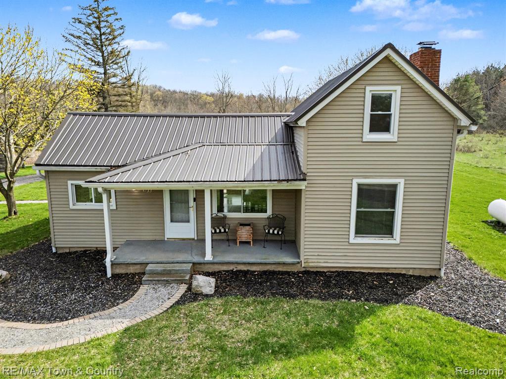 Nestled on 8.5 breathtaking acres, this beautifully updated farmhouse offers the perfect blend of charm and privacy. The property itself is exceptional, featuring scenic trails, wooded areas, and tranquil ponds—an outdoor lover’s dream. The home has undergone a major transformation, with the upper level taken down to the studs and completely rebuilt with new insulation, drywall, trim, flooring, paint, and fixtures throughout. The main floor welcomes you with an open and airy layout, ideal for everyday living and entertaining, along with a spacious first-floor laundry/mudroom and the comfort of central air. A new reverse osmosis (RO) system adds peace of mind, and all appliances are included for a move-in ready experience. The outside experience is AMAZING !!! A newly added deck and brick paver patio create the perfect setting to relax or entertain. The fenced yard area provides added convenience, and the 3-car garage/outbuilding offers ample space for vehicles, hobbies, or storage. Additional updates include a new driveway and landscaping.A rare opportunity to own a move-in ready farmhouse on a remarkable piece of land—don’t miss it!