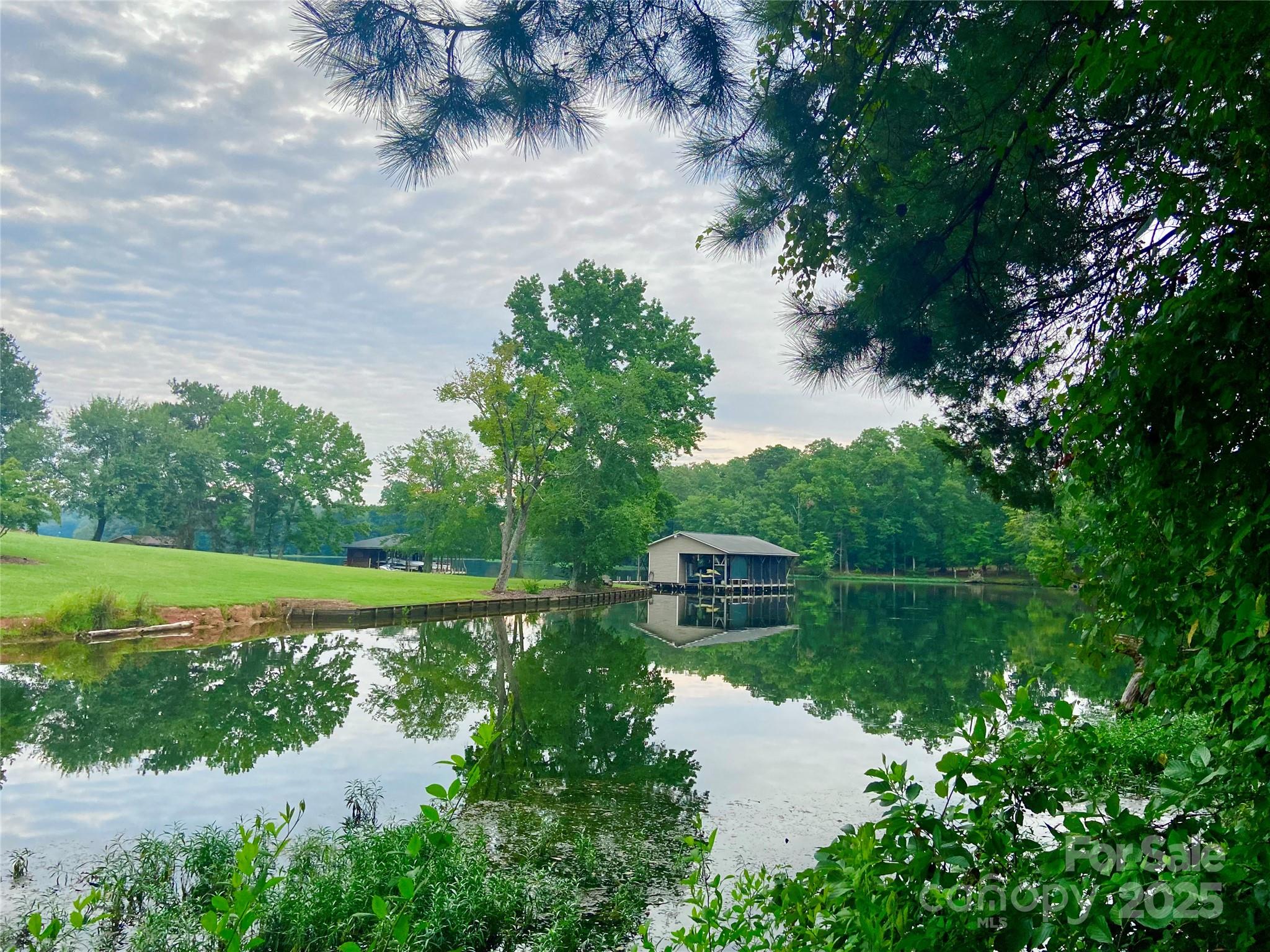 Lot #2 is a cove waterfront lot in Blakes Cove, a small private community with a paved street. The septic system has been approved for a three bedroom home and is included in the attachments. This large level lot is inside the city limits and provides all the conveniences of Norwood along with all that Lake Tillery has to offer. Agents and buyers to verify with Duke Energy that a shoreline lease and boathouses will be permitted. Minimum heated living area is 1,500 for one level home, 1,800 for 1 1/2 levels, and 2,400 for two story homes. HOA fees are $1,000. Annual.