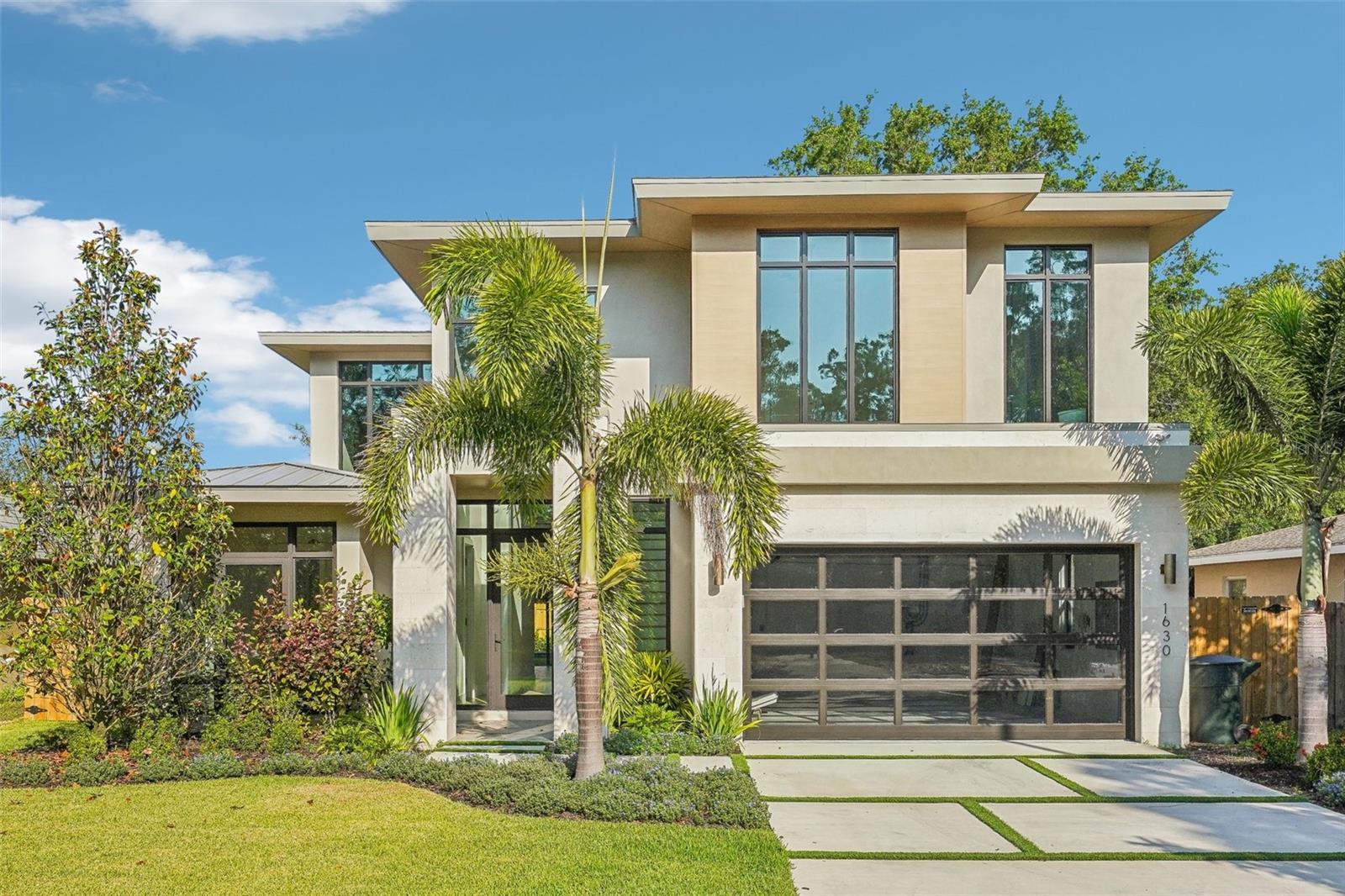 One or more photo(s) has been virtually staged. COMPLETED JANUARY 2025,  This stunning NEW CONSTRUCTION 4-bedroom, 3-bath, 2-story custom Spool home is located in the serene Dunedin Isle neighborhood, on the Pinellas Trail. With its rich history and lush, subtropical setting, Dunedin offers nearly four miles of waterfront, a relaxed lifestyle, and endless activities, making it one of Florida’s most charming places to call home. Whether you’re enjoying sunsets at Honeymoon Island or exploring the breweries, shops, and restaurants on Main Street, Dunedin is a vibrant destination for all.

This custom-built home is designed to seamlessly blend indoor and outdoor living, epitomizing true Florida lifestyle. Natural light floods the home through oversized, impact-resistant windows in every room, enhancing its airy, open feel. Boasting 2,660 sq ft of interior space (3,521 total sq ft), this home includes a spacious first-floor covered lanai and a second-story sun deck off the master suite. Situated on a large lot (60x119), the backyard is west-facing, offering a perfect view of picturesque Florida sunsets, surrounded by mature oak trees.

On the main floor, you’ll find an attached, oversized 2 car garage with plenty of storage space. The grand foyer leads to a first-floor in-law suite or office with an ensuite bathroom and walk-in closet, providing privacy and comfort for guests. The open-concept living, dining, and kitchen areas are ideal for large gatherings, with soaring ceilings, an eye catching chandelier, and a water vapor fireplace as the centerpiece. The gourmet kitchen is equipped with quartzite countertops, custom cabinets, a large island with a sink, top-of-the-line appliances, and a spacious walk-in pantry that includes a first-floor washer and dryer. A 16-ft pocket slider connects the kitchen to the SCREENED IN covered lanai, while two additional sliding glass doors from the living area open directly to the pool area, creating a true indoor-outdoor paradise.

Upstairs, the master suite is a private retreat, featuring a 25-ft sun deck overlooking the backyard and the Pinellas Trail. The ensuite bathroom is complete with double vanities, a luxurious shower with dual shower heads and a handheld sprayer, a separate water closet, and access to a large walk-in closet. For added convenience, a second washer and dryer are located on this floor. Bedrooms 3 and 4 share a Jack-and-Jill bathroom with a frameless glass shower, vanity, and tankless toilet.

The backyard oasis includes a sparkling pool, pool bath entrance, a 24-ft enclosed lanai, and a fully fenced yard with direct access to the Pinellas Trail, perfect for outdoor enthusiasts.

This home comes loaded with PREMIUM FEATURES, including spray foam insulation, RESTORATION HARDWARE LIGHTING FIXTURES, white oak engineered hardwood floors, DACOR APPLIANCE PACKAGE, surge protection system,  25 FT SHOW-STOPPING WATER VAPOR FIREPLACE, 85 inch Samsung “The Frame” TV, SPEAKERS IN LIVING ROOM, PRIMARY BEDROOM, AND LANAI, floating vanities, LEVEL 5 FLAT FINISH WALLS, just to name a few… These HIGH-END FINISHES make this property STAND APART FROM THE COMPETITION

NO DAMAGE FROM HURRICANES

Don’t miss your chance to own this spectacular custom home in the heart of Dunedin!