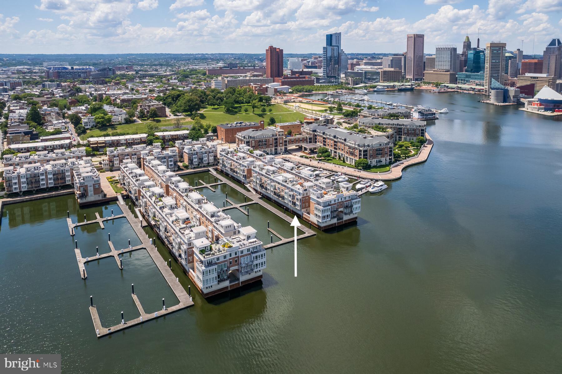 Pier Homes Living.  Experience The Difference.  Envision your new lifestyle at the distinguished The Pier Homes at Harborview.  Rarely offered, this recently renovated corner residence is just one of four St. Tropez floor plans available within the community.  This pristine condition, fully furnished, four bedroom home features an impressive contemporary floor plan with 4,535 square feet of luxury living & amazing direct waterfront views on all five levels.  The private location behind the gated entrance to Ponte Villas North combined with 24/7 security and private on-demand security escorts provides one of the most luxurious & secure lifestyles offered in Baltimore.  **EXQUISITE FEATURES INCLUDE** Five level glass elevator with automatic interior door, two gas fireplaces, upgraded hardwood flooring, granite countertops, gourmet kitchen with stainless steel GE Monogram appliances, gas cooking, wall oven, wine cooler, under cabinet lighting, family room surround sound rough-in, and roof level wet bar and hot tub.  Parking for two vehicles is provided for within the attached garage.   Three exterior balconies and the spacious rooftop terrace provide ample outdoor entertaining space and panoramic city skyline & water views.   Community amenities include 24/7 security & on-demand security escorts, a private guest parking garage, outdoor pool, private fitness center, concierge services, private trash & snow removal, marina, Cocktail bar, Italian deli & market and beautifully landscaped grounds.  A conveniently located water taxi can take you to explore any neighborhood in the city.  With countless shopping, dining and entertaining options just minutes away from this centrally located Inner Harbor property you can enjoy a lifestyle offered nowhere else in Baltimore.