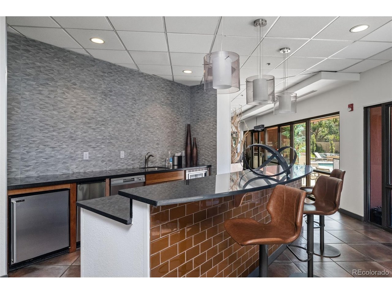 Experience elevated city living from the 13th floor of this beautifully maintained condo in the heart of Denver's vibrant North Capitol Hill neighborhood. Framed by sweeping city views this inviting 1-bed, 1-bath condo offers the perfect balance of comfort, convenience, and an unbeatable urban lifestyle. Thoughtfully designed to maximize every square foot, the spacious layout lives far larger than its footprint, creating an open and welcoming environment that's equally suited for quiet evenings at home or entertaining friends before a night on the town. The well-appointed kitchen features brand-new stainless steel appliances, while the generous living and dining areas flow effortlessly together to create a space that feels both comfortable and functional. Whether you're working from home, hosting guests, or simply relaxing while taking in the downtown skyline, every room is designed to make city living feel effortless. The spacious primary bedroom offers a peaceful retreat, complemented by a well-designed bath. Adding even more value, the seller has already paid the special assessment for the building's brand-new elevator. Beyond your front door, the lifestyle continues. Enjoy resort-style amenities including a luxurious outdoor pool, a fully equipped fitness center, secure building access with a staffed front desk, and the peace of mind that comes with professionally managed, lock-and-leave living. Even more rare are the two parking spaces-one reserved garage space and one additional surface parking space-an exceptional feature seldom available in this building and a tremendous convenience for both homeowners and guests. Whether you're looking for your first home, a low-maintenance downtown residence, or an investment in one of Denver's most desirable urban neighborhoods, this exceptional condominium offers the rare combination of stunning views, outstanding amenities, valuable parking, and an incredible location-all wrapped into one move-in-ready opportunity.