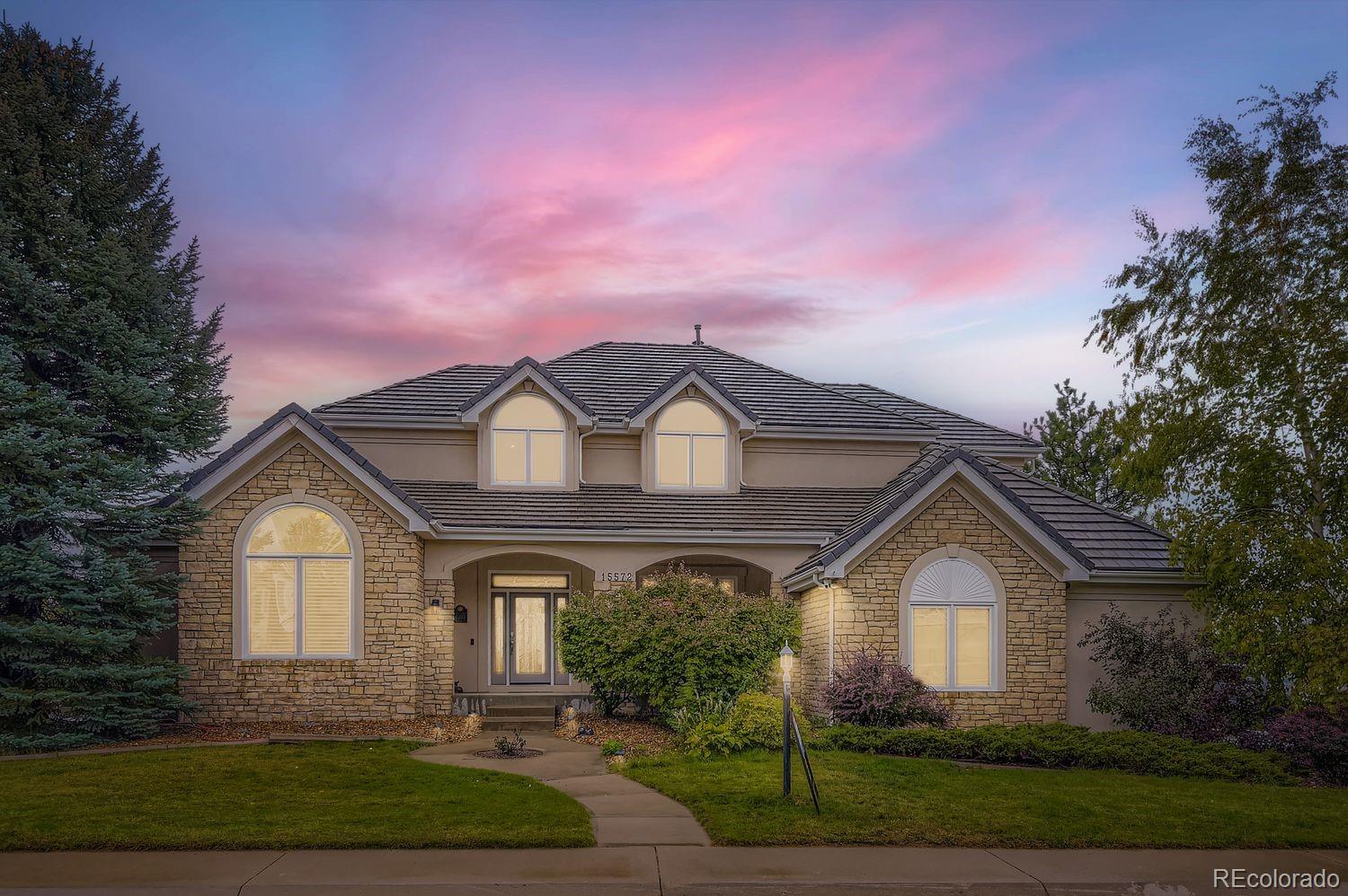 Extensively remodeled custom home with incredible panoramic mountain views in highly desired Piney Creek! Popular open floorplan featuring large family room with vaulted ceilings, built in entertainment center, and gas fireplace surrounded by designer tile* Newly renovated white kitchen with lots of cabinetry, plus pantry and tons of counter space, huge island with slab granite and designer back splash, High End Kitchen appliances with Monogram Refrigerator and adjacent eating space with access to oversized partially covered large and expansive deck with breathtaking mountain views overlooking enormous private flat yard with natural wood fire pit and fun playground and trampoline for kids. The main floor primary suite features remodeled primary bathroom including Slab granite countertops, Marble Tile Heated Flooring, Liquid Wall Paper, Full two people Bath Tub, Toto Heated Automated Bidet Toilet, Custom High End Hardware/ Faucets (from specialty store), and large walk in closet* Main floor also features large office, formal dining room and open living room with cathedral ceilings as well conveniently located laundry room with high end washer and dryer and space for second fridge* Upstairs, you'll find three generous bedrooms with two remodeled bathrooms and open playroom.  Professionally finished basement with high ceilings designed for ultimate entertainment and relaxation, featuring a spacious recreation area, a state-of-the-art theatre room with Projection, Screen, in wall Surround Sound speakers (included) and an additional guest suite. Three-car finished oversized garage with coated epoxy garage floor* Additional upgrades include updated hard wood throughout whole main level, new carpet upstairs and both stairwells, new tile in laundry room, and all bathrooms on main level and upstairs, new toilets, faucets and sinks in all bathrooms on main level and upstairs. One of the best inside lots in the complex with great curb appeal sitting on 0.4 acre. Will not last!