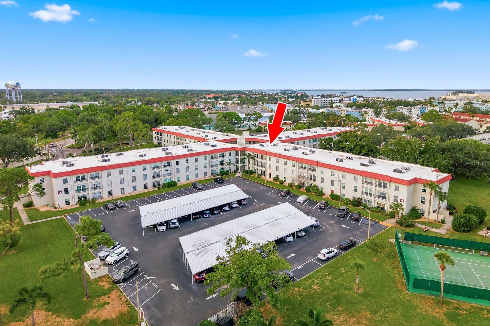 Live the Florida lifestyle in this remodeled first-floor condo.  You will love the thoughtful updates such as the wood-look tile flooring, impact windows and low-entry shower.  There is a large walk-in closet in the bedroom and also closets in the hall to store your beach gear.  Installation ages are as follows:  2025 roof, 2026 shower, 2019 windows and 2017 electrical panel.  Located in Dunedin’s Mediterranean Manors, unit 4102 is on the first floor and does not require stairs or elevator to access.  One of the highlights of the community is a waterfront park with kayak access to the Gulf and a view of the Dunedin Causeway and Honeymoon Island State Park.  The community offers a large pool, tennis/pickleball courts, shuffleboard, bocce ball, gym, clubhouse, kayak storage and grilling/picnic areas.  All ages are welcome!  The condo dues include all of the community amenities plus trash service, water, sewer, cable TV, Internet and landscaping.  There is a laundry room down the hall from unit 4102.  Several restaurants and shopping areas are less than one mile from Mediterranean Manors so you can spend more time enjoying yourself and less time on the road.  The Pinellas Trail is located across the street for a fun way to access downtown Dunedin, historic Tarpon Springs and vibrant Clearwater.  Book your showing now to start enjoying Florida this winter!