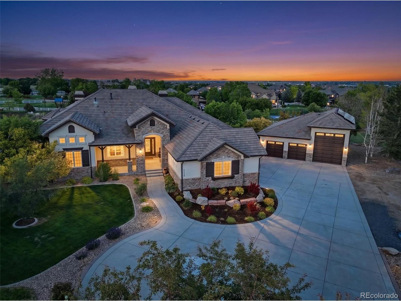 Welcome to an extraordinary estate in Spruce Meadows on a rare 2.79-acre homesite. This beautifully updated home offers luxury living with soaring ceilings, expansive spaces, and exceptional indoor-outdoor entertaining. The remodeled gourmet kitchen features Thermador appliances, a 6-burner gas cooktop, built-in ovens, icemaker, and easy access to the outdoor patio. The main-level primary suite offers a fireplace, sitting area, deck access, and a spa-inspired bath. All four bedrooms feature private ensuite baths. The finished walkout lower level includes a wet bar, family room, game area, exercise space, and media room with projector and surround sound. The game room also offers the flexibility to be converted into a fifth bedroom if desired. Resort-style grounds feature a pond with waterfall, elevated deck, outdoor TV, fire pit, bocce court, horseshoe pit, putting green, and access to the private stocked fishing pond with gazebo. The oversized outbuilding is a rare opportunity with endless possibilities-create the ultimate luxury RV garage, showcase a collector car collection with vehicle lifts, design an indoor sport court, install a golf simulator, or transform it into an incredible pool house or entertainment venue. The expansive acreage also provides multiple potential locations to add a custom pool while preserving the property's exceptional outdoor living spaces. Additional highlights include an oversized 4-car garage in addition to the already extensive outbuilding, invisible dog fence, and numerous upgrades throughout. A truly exceptional property offering privacy, recreation, flexibility, and luxury in one of Spruce Meadows' most desirable settings. For the Fly Through video visit: https://media.cineflyfilms.com/2949-High-Prairie-Way/idx