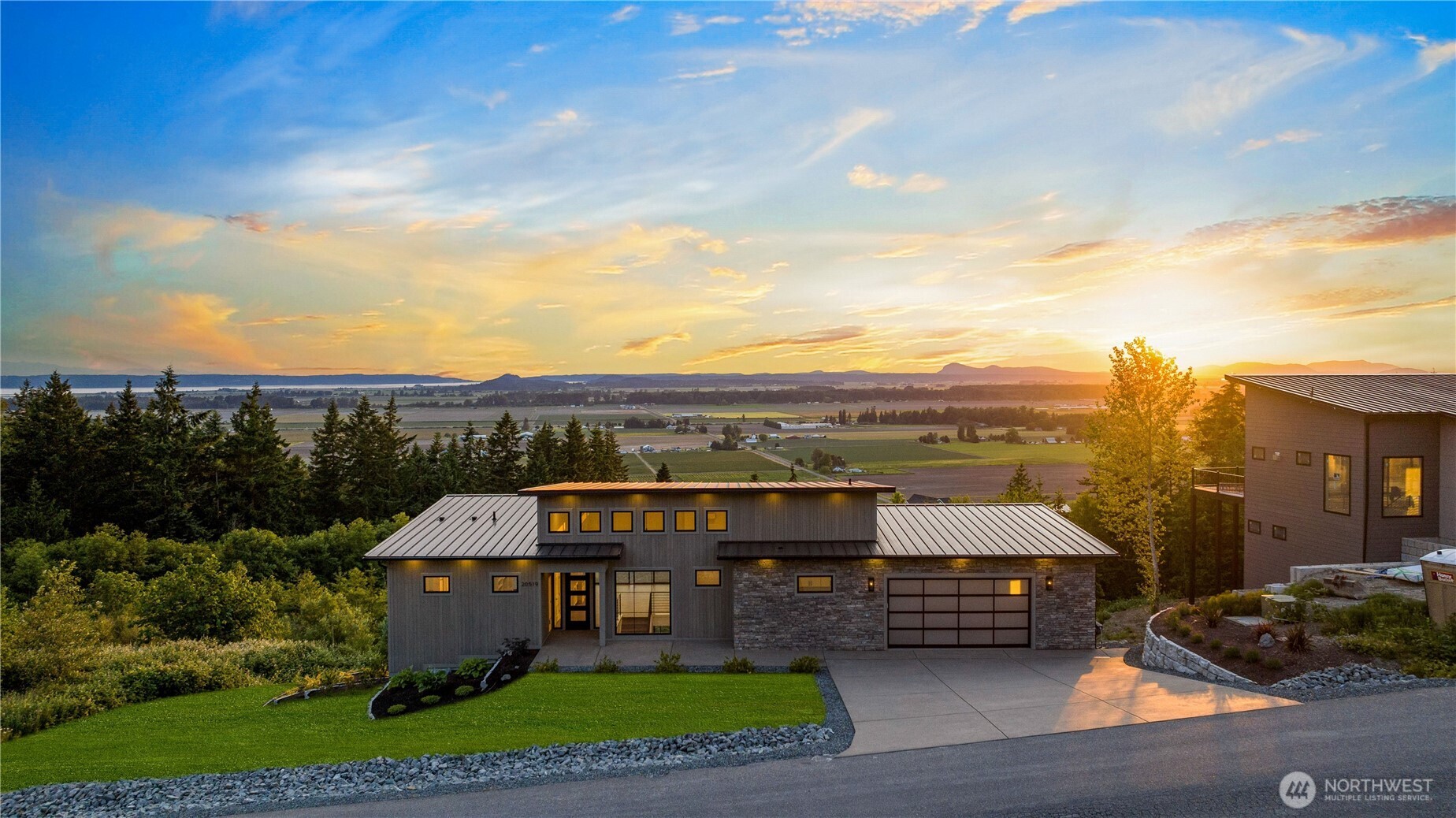 Stunning Luxury New Construction VIEW Home in Benson Ridge, Completed and Ready! Hezel Homes proudly presents this 1-Acre Quality View Home in the BEST new private neighborhood, with sweeping panoramic Western views over Farms, Sound, Mountains and Sunsets. Main-floor living w/ quartz slabs, gourmet kitchen boasting 3 ovens, 48" gas range and pot-filler. 3 large, private view bedrooms w/ adjacent/attd. guest baths, plus 2 offices, workout room, study and shop/mechanical room. Primary suite w/ heated tile, dual-head shower and soaking tub. Vaulted fireside great room, + covered/heated outdoor living space w/ tv, fireplace, & grill. Finished garage w/ epoxy full-flake floor. Wet bar. Bonus Room. RainBird sprinkler system. Custom closet organizers. Welcome Home!