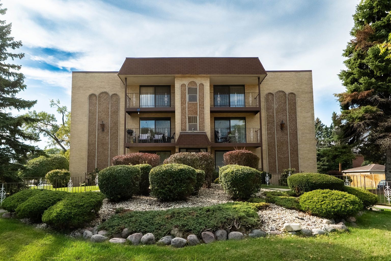 Welcome to this spacious third-floor condominium, where natural light, hardwood floors, and an open layout create a warm and inviting atmosphere. At the heart of the home, where the kitchen is located, open in design, and finished with stainless steel appliances. A private balcony it's a true extension of the living space, offering views of greenery and mature trees. Perfect for a morning coffee or evening relaxation. One of the bedrooms features a Australian wool carpet, one year old, adding both comfort and elegance. Both bathrooms have been renovated, and this unit also includes new windows - a valuable upgrade, as each owner in the building is responsible for their own. Ample closet space and additional basement storage provide practical convenience.  The unit includes a garage parking spot conveniently located by the elevator plus an additional outdoor space. Recent building improvements includes brand-new driveway and an outdoor security camera system. Set in the a quiet, concrete-structured building. Heat, gas is included in the assessment. One garage space and one outdoor parking space.  GREAT LOCATION!  RENTS ARE ALLOWED!