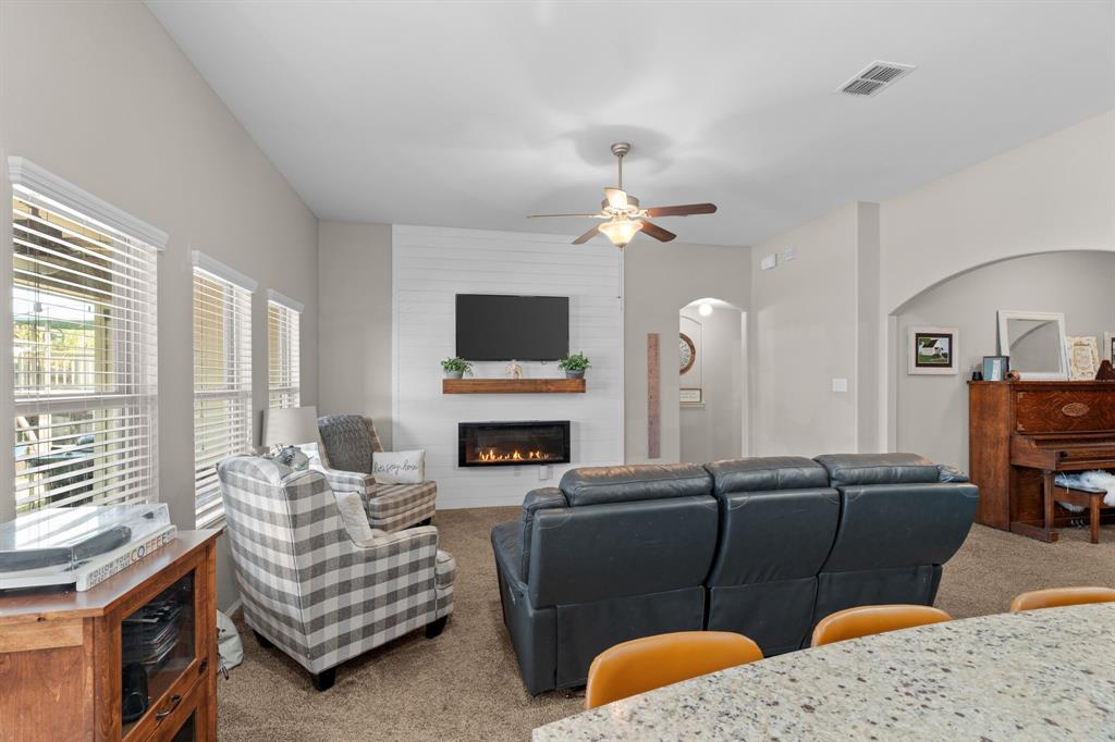 Motivated Seller! Stunning Home with Bonus Spaces, Backyard Retreat & $2,000 Flooring Credit!
This beautiful 4-bed, 2.5-bath home offers 2,372 sq ft of flexible living space, including two bonus rooms perfect for a home office, playroom, or media room. This home is perfect for growing families, remote work, or entertaining. Enjoy a bright living area with high ceilings, custom shiplap wall, rustic mantel, and electric fireplace. The kitchen features granite countertops, stainless appliances (Bosch dishwasher), and a large island with bar seating.Outside, relax on the extended patio under a pergola with a brand-new metal roof. The fully fenced yard includes a large playset and a charming wooden playhouse. Added bonus: custom Christmas lights stay with the home to make holidays special, as well as added overhead garage storage. The carpet is in great condition, but sellers are offering a $2,000 flooring credit so buyers can personalize the flooring to their taste.
Located in Sendera Ranch with pools, trails, parks, and a top-rated NISD elementary school just a short walk away. Surrounded by truly great neighbors in a friendly and inviting community, this home has been filled with love and incredible memories. Schedule your showing today!