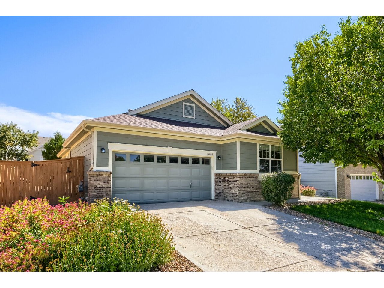 Freshly updated and move-in ready, this inviting 3-bedroom, 2-bath ranch offers comfortable one-level living in the desirable Buffalo Mesa neighborhood. Ideally situated on a quiet street, the home has been thoughtfully refreshed with new carpet, fresh interior paint, updated painted cabinetry, new exterior lighting, and LED lighting throughout. Stainless steel appliances and a bright, neutral color palette create a clean, welcoming feel from the moment you step inside.One of the home's standout features is the exceptional outdoor living space. An expansive patio and composite deck provide plenty of room for entertaining, dining, or relaxing outside, while the covered outdoor area with fireplace creates a comfortable gathering space. The well-cared-for, xeriscaped landscaping offers an attractive, lower-maintenance setting with pathways around the home.Additional peace of mind comes from an HVAC system that is approximately four years old. The functional ranch layout, fresh updates, outdoor living spaces, and attractive price point make this a home that is easy to enjoy from day one.Buffalo Mesa adds even more to the lifestyle with a neighborhood pool, parks and playgrounds, walking and biking trails connecting to nearby open space, and convenient access to Buffalo Run Golf Course. Turnberry Elementary is located within the neighborhood, with additional recreation, shopping, dining, and everyday conveniences nearby.A well-cared-for ranch with thoughtful updates, great outdoor spaces, and a convenient neighborhood setting-ready for its next owner to call home.