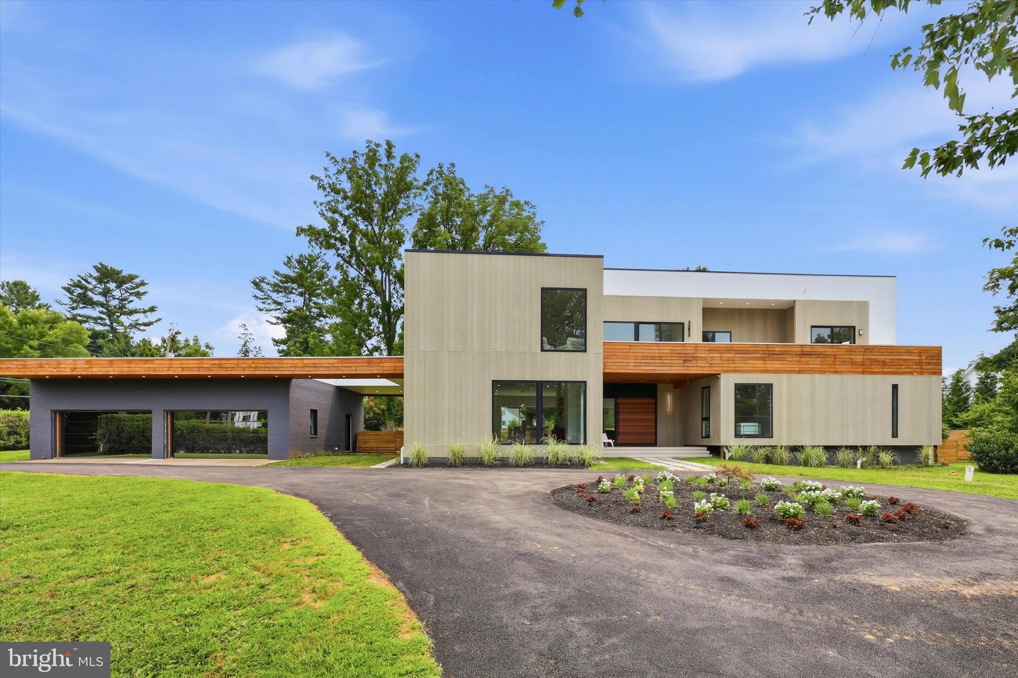 Introducing a rare opportunity to own one of Chester County's most impressive newly built residences — a stunning contemporary masterpiece that seamlessly blends architectural sophistication with everyday livability.Spanning an expansive footprint on a beautifully appointed lot, this extraordinary home offers 5 to 6 bedrooms and 6 full bathrooms plus 2 half baths, providing abundant space for comfortable living and entertaining. Floor-to-ceiling and oversized windows flood every room with natural light,  creating a seamless connection between interior living and the outdoors.The open-concept great room is the heart of the home, anchored by soaring ceilings and dramatic window walls that make a bold design statement. The chef's kitchen is outfitted with premium finishes and flows effortlessly into the dining and entertaining areas — perfect for hosting at any scale. Each bedroom suite is generously proportioned, with the primary retreat offering a spa-caliber bath and a sense of private sanctuary.A true standout feature is the detached 4-car garage, finished to an exceptional standard and equipped with one-way glass garage doors — a sleek, modern touch that allows natural light in while maintaining privacy and a polished exterior aesthetic.Located in sought-after Chester County, this property offers the perfect balance of peaceful suburban living with convenient access to top-rated schools, fine dining, charming local shops, and commuter routes to Philadelphia and beyond.This is modern luxury living — elevated, refined, and built for the way you live.Equal Housing OpportunityAgent has a financial interest in this property