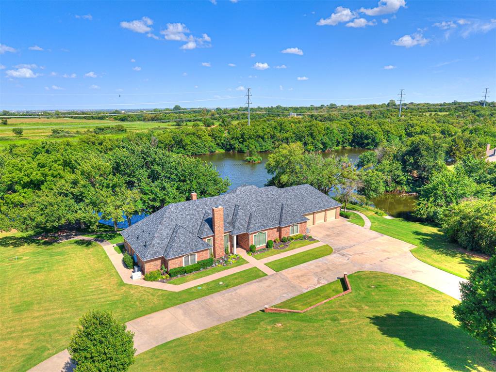 Step into lakeside luxury at its finest. This exceptional home was custom-built and the attention to detail is nothing short of extraordinary. Nestled on the shores of a stunning 20-acre lake. With unmatched views, serene surroundings, and ample space for both relaxation and recreation, this property offers the perfect blend of privacy and convenience. The grand entry welcomes you with a wide arched doorway. The foyers’ stunning architectural detail sets the tone for this remarkable home. The formal dining room boasts a soaring ceiling with large windows while the formal living room offers a sitting area with an elegant fireplace. The spacious kitchen, family room, office and primary bedroom all have massive windows that overlook the lake. The kitchen is a chef’s dream with brand new appliances, a large island, built-ins, and abundant storage, perfect for indoor and outdoor entertaining. The master suite has a multi-purpose room that opens to the outdoor living area. With too many amenities to list, this home is a rare opportunity to experience. Whether you’re kayaking at sunrise, enjoying the expansive grounds, or entertaining guests in a beautifully designed home, every moment here is nothing short of extraordinary. Don’t miss the opportunity to own this rare waterfront retreat located in Piedmont school district.  Beyond the main residence, the estate features a 40x60 shop with an apartment. Providing additional space for guests of extended family. Perfect for your storage or car collection. This home has a brand new roof.