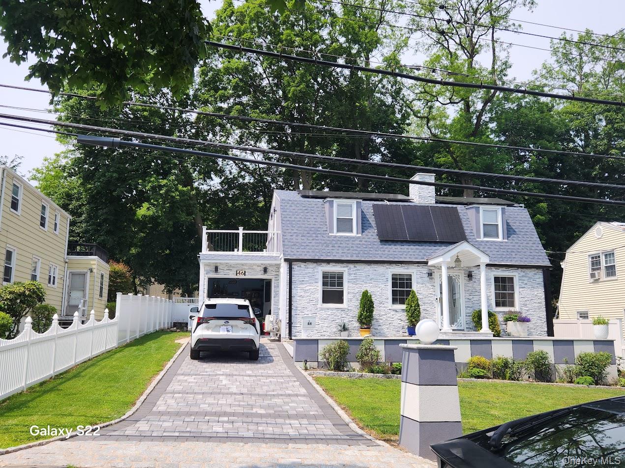 Welcome to your dream home! This beautifully maintained 3-bedroom, 2 full-bath single family residence blends modern comfort with classic charm. Step inside to a newly renovated kitchen featuring stainless steel appliances, sleek cabinetry, and stylish finishes—perfect for both everyday living and entertaining. Enjoy year-round comfort with high efficiency split A/C and heating units, a brand new boiler, energy saving solar panels, and brand new windows that flood the home with natural light. The finished basement adds versatile living space, ideal for a media room, home office, or guest area. Step outside and relax on your private balcony, a perfect spot for morning coffee or evening unwinding. Outside, you'll find fresh stonework, a welcoming front yard, and a new roof offering peace of mind for years to come. Parking is easy with a one-car garage and a two-car driveway. This home truly checks all the boxes: move-in ready, energy efficient, and loaded with updates. Don't miss the rare opportunity to own a thoughtfully upgraded home in a desirable location!