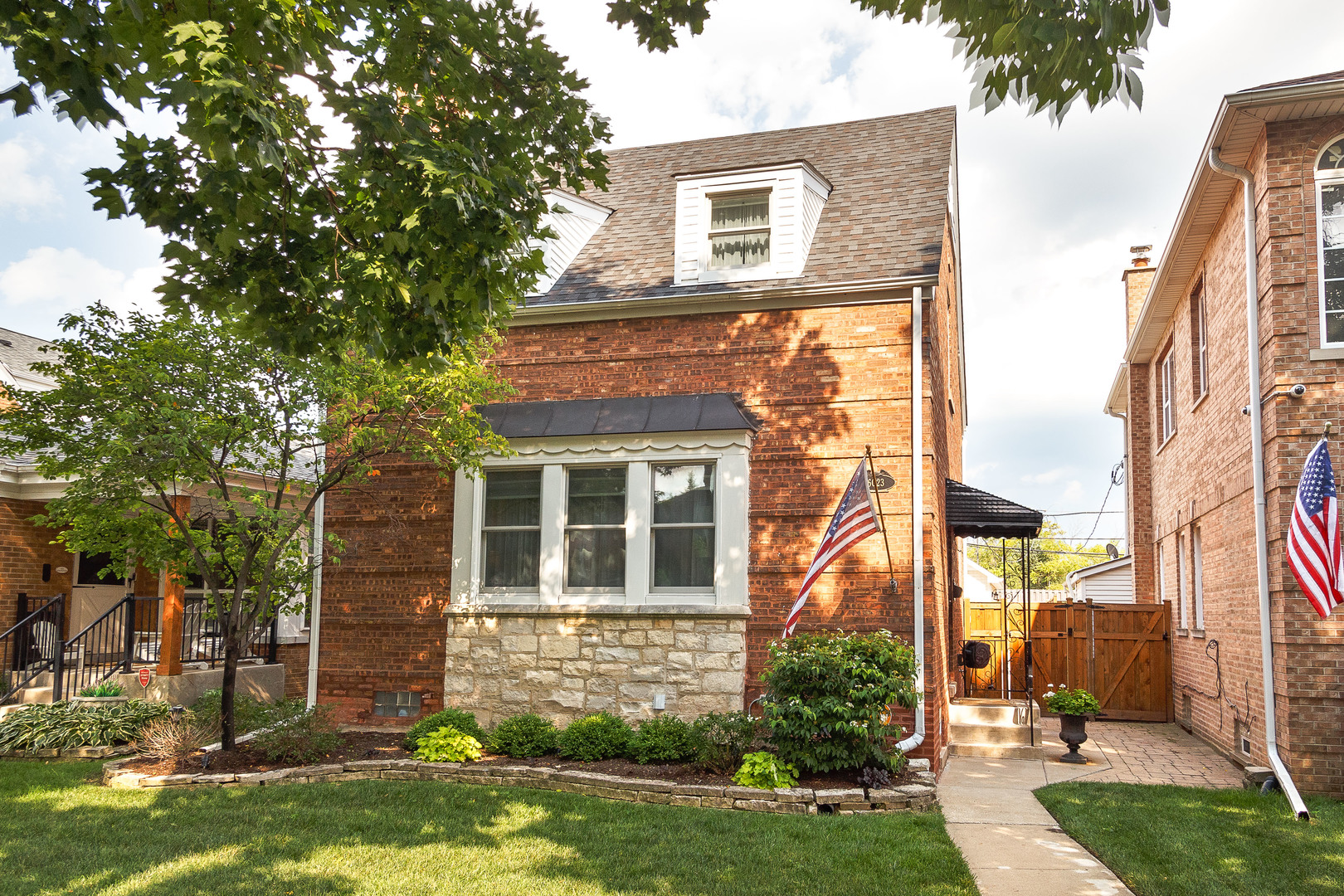 Sauganash Charm Meets Modern Living in this beautifully maintained and thoughtfully updated 2-bedroom, 2-full bathroom brick Cape Cod - the perfect balance of timeless charm and modern convenience, nestled on a quiet tree-lined street in highly sought-after Sauganash. This home provides easy access to forest preserves, bike trails, top-rated schools, local shops, Whole Foods, and effortless commuting via I-94, Metra, and CTA. Interior Features: Bright & inviting living room with large windows, hardwood floors, and a cozy fireplace framed by custom built-ins. Updated kitchen with granite countertops, stainless steel appliances, and a breakfast bar. Separate dining room with hardwood floors, generously sized bedrooms with hardwood flooring along with a fully finished basement offering a flexible family room/home gym, full bath, laundry area, and office. Outdoor Living: Step outside to your private backyard oasis - a beautifully landscaped retreat with: brick-paved patio (2021), motorized awning with lights (2024),  lush greenery and multiple seating areas perfect for entertaining. Includes a newer 2-car garage with extra-large attic storage (2016).Major Improvements throughout the home & Upgrades ($130K+). A "Home Improvement Summary" can be found in additional documents.