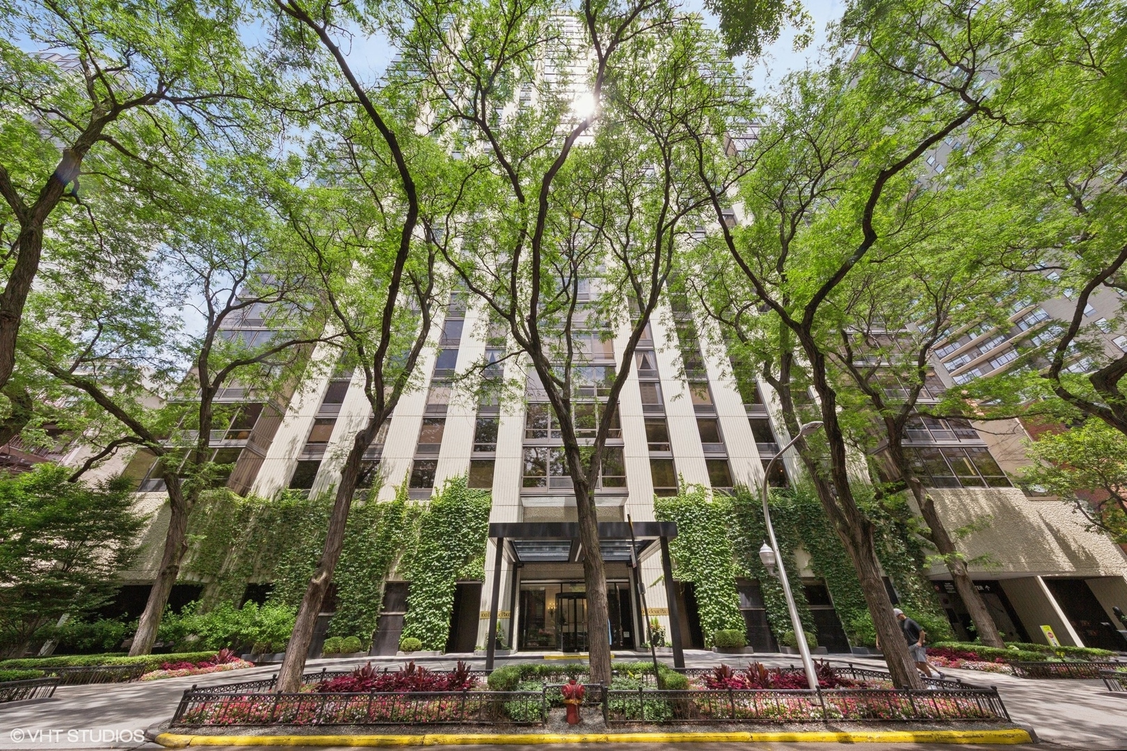As soon as you enter this beautifully renovated unit, you'll appreciate everything from the quality finishes and attention to detail to expansive open city and lake views. The modern kitchen features sleek cabinets and open shelving, Sub-Zero and Miele appliances, white stone backsplash laid to the ceiling and cool sconce lighting.  Crisp white counters with a one seat breakfast bar for coffee and laptop mornings, cookbook reading or chef's assistant station. The walk-in pantry is outfitted with an Elfa closet system and serves as a laundry room, featuring an in-unit (rare find) Bosch washer/dryer. Floor to ceiling windows showcase the incredible views from this Northwest corner unit overlooking charming Gold Coast buildings, lake views and Oak Street Beach. The extra wide living room is spacious, comfortable and combined with a full dining room for wonderful entertaining space and flow. The 3rd bedroom has pocket doors open to the living space, double closets and serves as the perfect home office or guest room. Spacious primary bedroom is set at the back of condo for privacy and features two nice sized built out closets plus walk-in closet and en suite gorgeous marble baths with high end Hansgrohe fixtures, Robern medicine cabinet and marble stone. 2nd bedroom is also a comfortable size and across from another modern and chic white bath with the same high end touches as the primary bath. Pristine Oak floors are laid on angle through common rooms and halls, new HVAC blower system was installed in 2024, freshly touched up with paint and ready to go! Building has a resort like rooftop with expansive views, pool, deck chairs and pergola, fire pits, grills and dining tables. Full service building with door person, engineer, manager and garage attendants on staff, fitness room, party room, additional storage and monthly parking for an extremely reasonable rate of $210 a month plus guest parking available. Location is wonderfully located on tree-lined Bellevue, a block to restaurants, shops, the lakefront, Oak Street Beach, Michigan Avenue and public transit.