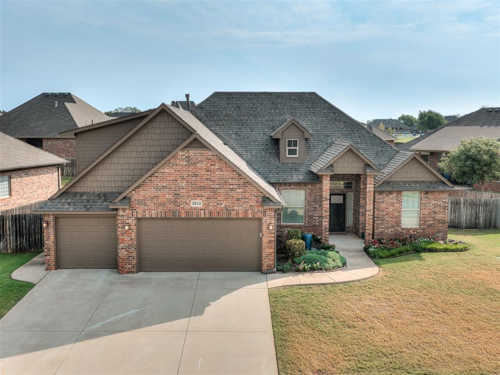 Beautifully designed home in Norman’s sought-after Highland Village community, offering high-end finishes, exceptional neighborhood amenities, and a versatile floor plan that adapts to nearly any lifestyle. With 2,558 square feet, 4 bedrooms, 3 full baths, and a 3-car garage, this home provides an impressive combination of space, quality, and functionality.Inside, gorgeous real hardwood floors flow through the main living areas, complementing an open-concept living, kitchen, and dining space ideal for both everyday living and entertaining. A gas-log fireplace anchors the living room, while quality finishes and thoughtful details create a warm, elevated feel throughout.The flexible split floor plan sets this home apart. The private primary suite is separated from two additional main-level bedrooms, while an additional room with a closet can function as a dedicated office, bedroom, or flex space. Upstairs, a spacious bedroom/bonus room features its own full ensuite bath and large closet—perfect for guests, a second living area, game room, or private suite.Outside, enjoy a covered patio and fenced backyard, plus the convenience of a 3-car garage. A new roof was installed in 2025, and the kitchen refrigerator, washer, and dryer remain with the home.Highland Village offers an outstanding neighborhood lifestyle with a community pool, clubhouse, playground, parks, pond, and walking trails. With neighborhood amenities just around the corner, this home delivers the space and finishes buyers want with the community experience to match. A beautifully finished, incredibly versatile home in one of Norman’s established communities.