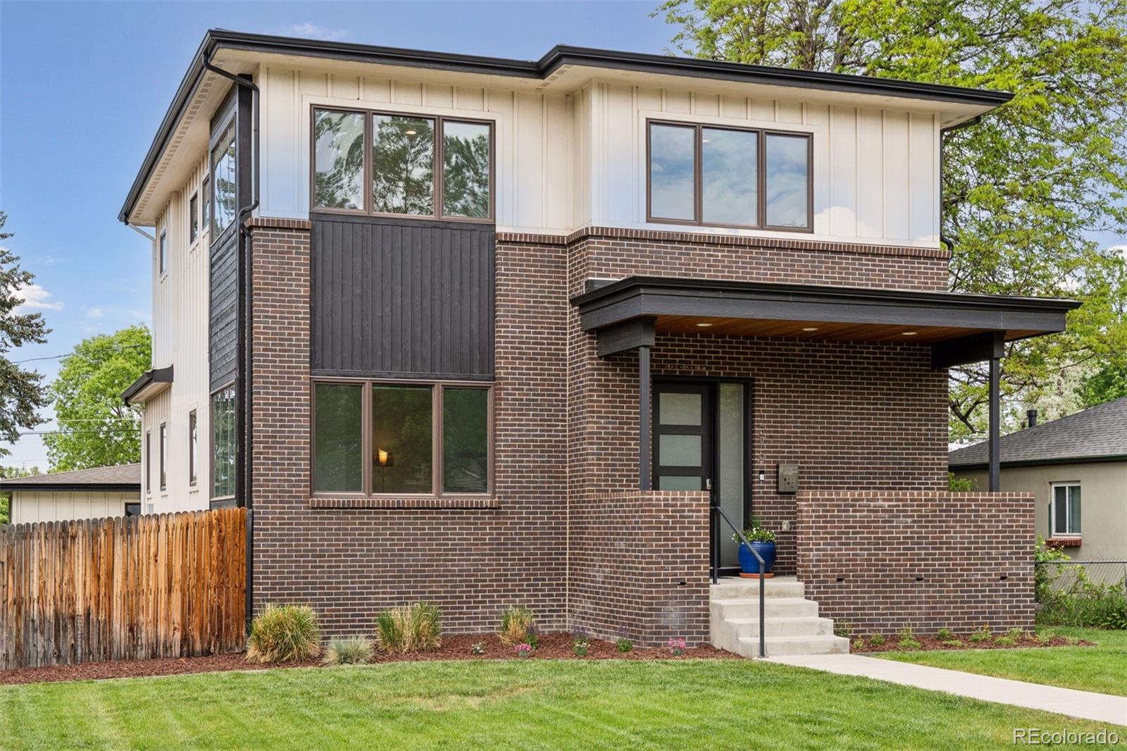 This well priced modern Denver Square in the Cory-Merrill neighborhood offers 3400 square feet of well-designed living space. Built in 2017, the home features thoughtful upgrades throughout. The main floor includes an office, dining area, and great room with a built-in gas fireplace. The kitchen is designed for both function and style, with modern white cabinetry, an expanded island, gas stove, side-by-side refrigerator and freezer, beverage/bar refrigerator, built-in microwave, and plenty of storage. Large windows throughout provide abundant natural light, and the layout flows easily from the house into the private backyard. Upstairs, you'll find three bedrooms, including a spacious primary suite with a walk-in closet and a five-piece bath complete with a free-standing tub and oversized shower. The primary bedroom also features a custom paneled wall that adds a clean, modern accent. Two additional bedrooms, a full bath with double sinks, and upstairs laundry complete the second floor. The finished basement has high ceilings, a large bedroom, stylish bathroom, and a large family room that adds great flexibility for entertaining or relaxing. Additional highlights set this home apart with its cohesive blend of modern style and thoughtful craftsmanship. Wood floors run throughout the home, complementing the sleek quartz countertops and clean-lined modern fixtures. Custom tilework adds subtle personality to each bathroom and living space, while exposed steel architectural beams introduce a modern feel. Single-panel doors and glass shower enclosures contribute to the clean, streamlined aesthetic. The home is also equipped with a tankless water heater, built in speakers, and is finished in a neutral, contemporary palette that lets the quality finishes and design details take center stage. Located just a short walk from Cory Elementary and Merrill Middle, with easy access to Washington Park, and Bonnie Brae.
