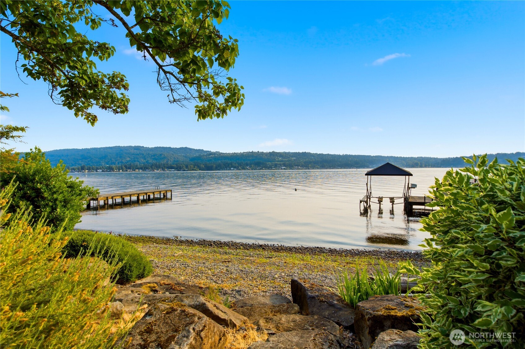 Private waterfront dock on Lake Sammamish offering boating, paddleboarding, swimming and spectacular sunsets.