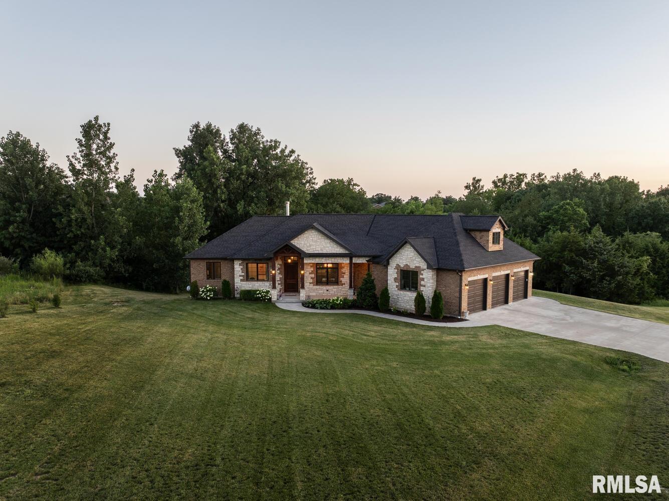 Immaculate custom home built in 2020! Every detail to this 3 bed 2.5 bath Brian Schutte built home was carefully thought out. From the 8' doors, walk-in pantry, dog wash station, mudroom, expansive walkout basement, and stone fireplace, this home has tons of extra features. The kitchen, the heart of every home, is well appointed with tall, two tone custom Concord cabinets, large granite island, ornate trim, and some of the best views in the house. The 10' ceilings and large windows throughout the open concept floorplan allow for perfect entertaining and full appreciation of the wooded 2 acre lot. Close to everything in Quincy & a short drive to Hannibal. When you set up your appointment, try and find the secret safe room. Offers due to agent by Thursday, July 31 at 2:00 pm.