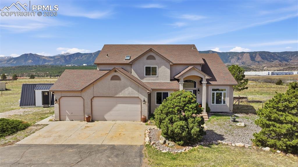 WHERE COLORADO LIVING MEETS FREEDOMEvery morning Pikes Peak is your view — and that's just the beginning.Almost 5 acres and this rocking 4,000+ sq ft home is for people who want it all: space, views, options, and easy access to everything. From Denver to downtown, you're minutes from everything— it's all here.KILLER VIEWSThe back of this home is a wall of glass. An ever changing and explosive view of the Rockies and the Peak pour Into the HUGE sunroom. This is why people move to Colorado!A DAZZLING KITCHEN Stone countertops. A chef's gas range. A large island with a breakfast bar is the heartbeat of the home. From Sunday brunch to weeknight dinners, fixing and sharing meals is a whole lot more fun.  LIVE BIG. LIVE FREE.No HOA. Well and septic — your own utilities, your own rules, shielded from ever-rising city rates. Horses are welcome here with room for a barn for your hoofed friends, ATVs, boats, or gear. Plant and grow your business here or just keep your options open.THE BASEMENT, THE PATIO. THE HOT TUB.  Finished lower level gives you the flex space you actually need — home gym, theater, office, guest suite — you decide. The hot tub and flagstone patio puts the Front Range sunset BAM, right in front of you. Every. Single. Night.BUILT-IN BONUS.  A 400 SF TINY HOME.Negotiable with purchase — perfect for multi-gen living, a home office, or rental income. This kind of versatility is rare.THIS ISN'T JUST A HOUSE.  It's a lifestyle upgrade with tons of options.