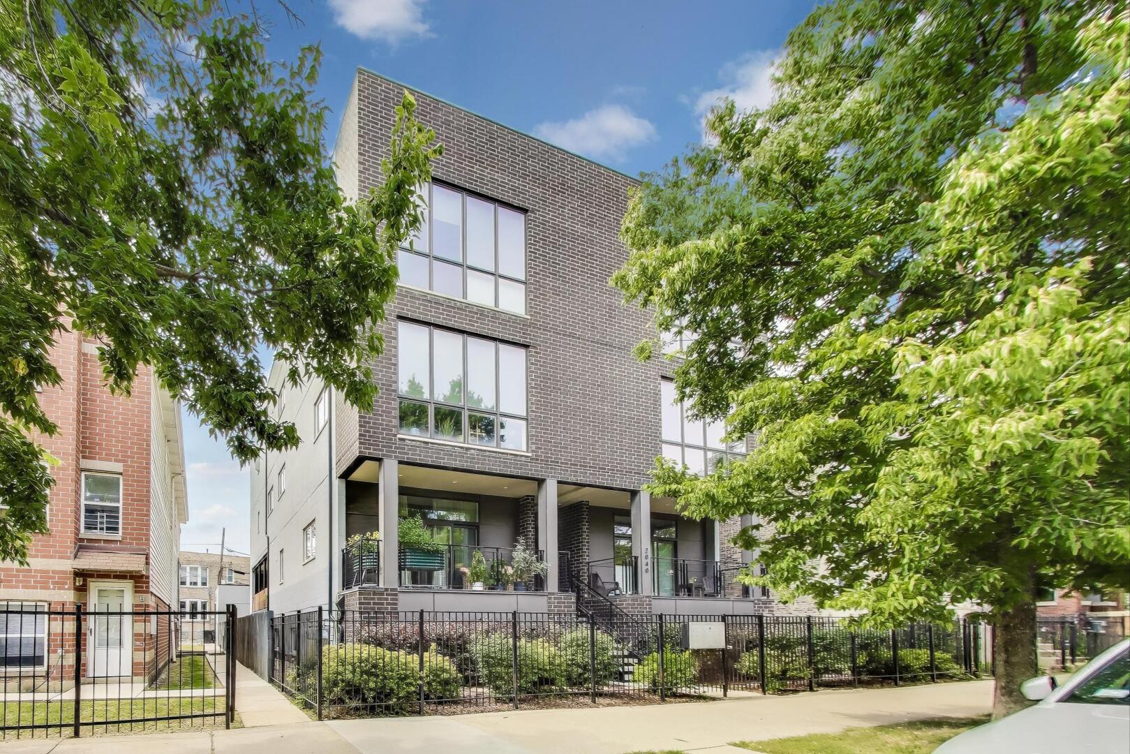 Incredible extra wide 3BR/2BA condo in Logan Square with a massive 450 square foot private garage rooftop deck. This newer construction home, built in 2018, features 21-ft wide interior, 10-ft ceilings and over-sized windows to give a very bright & airy feel overlooking the treetops. The fantastic open kitchen with large island boasts two toned custom cabinets, quartz countertops, stainless steel appliances by Bosch including a beverage cooler & a direct exhaust hood, undermount lighting, and a designer tile backsplash. The giant living & dining room combo with an accent wall, includes integrated 5.1 surround sound. The luxurious primary bedroom can easily accommodate a king-sized bedroom set and includes another accent wall and a walk-in closet. The magnificent primary bathroom has a walk-in rain shower with steamer, double quartz vanities and a heated floor. Both the 2nd & 3rd bedrooms are generously sized that can fit queen-sized bedroom sets easily and are perfect for a nusery/guest room/office. The secondary bathroom is nicely finished with a deep soaking tub & designer tile work. This homes has great storage with organized closets throughout, a large coat closet, pantry closet, and laundry closet with a side-by-side washer & dryer. The TWO outdoor spaces includes a large back terrace with a gas line for a grill. The amazing garage rooftop deck is upgraded with composite decking and an aluminum pergola for ultra low maintenance. The outdoor furniture and garage parking are included! Phenomenal location that's steps to The 606, Palmer Square, some of the city's best dining/coffee/cocktails, shops, and nightlife.