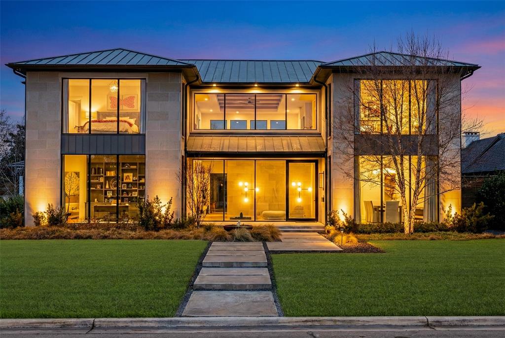 Absolute showstopper situated on an oversized lot in the fairway of Preston Hollow. Thoughtfully planned by Ikemire architects & styled by Morgan Farrow Interiors, this home is a true sanctuary of modern elegance & sophisticated comfort. Completely custom Knox Built of Tatum Brown Custom Homes with landscape design by DDLA. Step inside to soaring 11-foot ceilings & expansive floor-to-ceiling windows that flood the space with natural light, creating an airy, welcoming atmosphere. Interior is a seamless blend of opulence & warmth that will impress the most discerning buyers. Exquisite materials like book-matched white & black marble backsplash, enormous 17ft marble island, rich white oak accents & textured walls that evoke a sense of cozy indulgence. Custom wallpaper, designer lighting fixtures, & a striking oak piano key wall add personal touches of artistry throughout. The chef’s kitchen is a culinary dream, boasting a massive island with hidden storage, built-in Wolf and Sub-Zero appliances, and full butler's pantry. Spa-inspired master suite, complete with a fireplace, dual vanities, an oversized steam shower, heated marble floors, & an expansive walk-in closet illuminated by LED lighting on every rack & shelf. Entertain effortlessly in the resort-style backyard, where shimmering pool, spa, fire pit, & outdoor kitchen beckon for large gatherings. Glass pocket doors slide open for easy indoor-outdoor living. The backyard also features artificial turf, electric pool cover for safety & temperature control, storage building, and two dog runs with crushed granite and stone. 50yr standing seam steel roof. Laundry room on 1st and 2nd floor. Downstairs guestroom with ensuite bath. Upstairs retreat features massive 800+sf game room with tons of storage and wet bar plus three more large bedrooms with ensuite baths and walk in closets. $100k+ of media & smart home equipment stays with the home. Close to elite private schools, stylish retail shops, and fantastic restaurants.