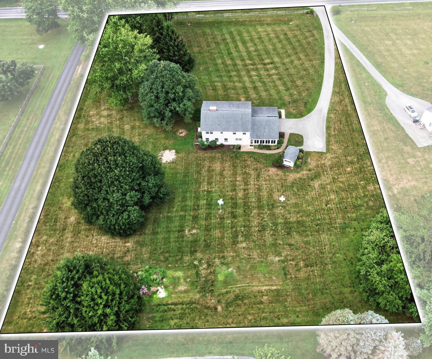 Truly love where you live --- the perfect blend of quality craftsmanship, delightful design, and inviting spaces! Welcome home to 810 Dowlin Forge Road, nestled on a park-like setting of 2 acres of grassy yards; artfully landscaped blooming gardens; and mature shade & ornamental trees. Downingtown East schools and NO HOA! Quick access to Rtes 113, 100, 401, PA Turnpike and just minutes to Chester Springs/Exton/West Chester, STEM Academy, shopping, dining, parks, and everywhere you want to be! Custom built by Doutrich Homes this home includes many sophisticated appointments and careful attention to efficiency, like the 8.5 inch insulated walls. Up the front walkway and you are greeted by the stylish front door with its beveled glass insert, balancing natural light with privacy as you enter into the Reception Foyer. The elegant Living Room is highlighted by rich wide-plank hardwood floors, refined crown molding, and a classic wood-burning fireplace with a beautifully detailed mantel and brick hearth. The stained pine floors and millwork accents continue into the gracious Dining Room, with space to easily accommodate large gatherings and holiday celebrations, and like the Living Room it also has two oversized sun-filled windows. Paradise Custom Kitchens beautifully remodeled the Eat-In Kitchen, which features articulated Corian counters; custom tile backsplash; gas cooking; center sit-up island w/pendant lighting; pantry; recessed lights; and for maximizing both efficiency & style there are pull-out drawers plus a 2-shelf lazy susan. The Family Room is anchored by a striking floor-to-ceiling brick hearth featuring a classic wood/coal stove. It is flanked by custom built-in bookcases and cabinetry, and multiple windows bathe the room in natural light and frame the picturesque outdoor views. Adjacent is the main floor Powder Room and access down to the Full Basement --- do not miss the new (2025) hot water heater, plus the whole-home Generac generator system for so much added peace-of-mind! WOW! --- the Sunroom is going to become your new favorite place! With walls of sunlit windows with transoms showcasing the sweeping yards & gardens; tongue-and-groove wood walls and vaulted ceiling; ceramic tile flooring; ceiling fan; and baseboard heat. An idyllic space to relax, entertain, or simply enjoy every season in comfort. From here there is a french door out to the Patio and brick walkway to the shed and expanded driveway (for 6+ vehicles, RV, etc.) plus there is inside access into the oversized side-entry 2 Car Garage. Upstairs the spacious Primary Suite includes Bedroom; huge 7x6 walk-in-closet; and a sumptuously remodeled Full Bath with a raised vanity w/pull-out storage; recessed mirrored cabinet; tile floors, and a spa-inspired walk-in shower designed with floor-to-ceiling tile, frameless glass door, dual shower heads/docked wand, plus a small foot ledge & a recessed shelving niche. Down the hall are three more Bedrooms all with ample closets; a custom laundry chute; and a Full Bath with tub/shower combo that has also been updated through the years. One Bedroom has been redesigned with LVP flooring and recessed lights --- these owners used it as a crafting/quilting room but could be an office or gaming room or fitness space! All windows on this floor have been replaced/updated. The gorgeous 2-acre yards are every bit as impressive as the home itself, with expansive lawns; vibrant perennial gardens; and glorious shade and specimen trees. Such an ideal setting for entertaining, recreation, gardening, bird watching --- create so many wonderful new memories year-round! BONUS --- includes an AHS ShieldComplete Home Warranty, which is their top-tier level of coverage & meaningful protection for your new home-sweet-home! Some photos virtually staged. Verification (including sq ft/size/lay-out/more) lies with the consumer.