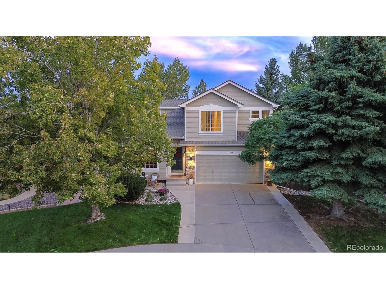 Perched on a lush cul-de-sac lot with mountain views, this gorgeous home offers a rare and private setting, as well as several flex spaces for you to personally create the functionality you need. A charming curb appeal welcomes you to 3 bedrooms, 3.5 baths, open layout, walk-out lower level with large bonus room and 2-car garage. The upgraded kitchen with custom knotty alder cabinets and vast storage is further warmed with granite, stone and wood. A portion of the island can be converted into a stand-alone table to adjust the room to your liking. A cozy fireplace and gorgeous mantle anchor the other end of the great room, offering everyday comfort and elegant entertaining where kids, guests and cooks can intermingle. The rich lounge-like dining & living room graciously hosts your evening cocktails and holiday meals. Vaulted ceilings provide an airy feel with large windows to peer out into the greenery, as if you are in a treehouse. The inside seamlessly flows to the outside onto the deck and lower patio. A designer palette with Oak/Brazilian hardwood floors, as well as new high-end soft wool carpeting, set the stage for a contemporary, durable lifestyle. Upstairs, a hardwood hallway leads to 2 bedrooms and full bath. The large primary bedroom connects to an en-suite bathroom where the walk-in closet holds a laundry shoot connected to 2 laundry hook ups to choose from: main floor or lower level. A vaulted ceiling and large window with views adorned the retreat. The lower level features a big great room with built-in shelving for flex space use as a 2nd tv area, a guest suite, playroom, home gym or combination of them all. A separate office with a lovely paned glass door is great for working from home. A bathroom re-modeled in 2025, as well as backyard and patio access complete the area. This is a special one-owner home in the highly coveted, quaint Fairway Vista ll community where listings are rare. Come see it today!