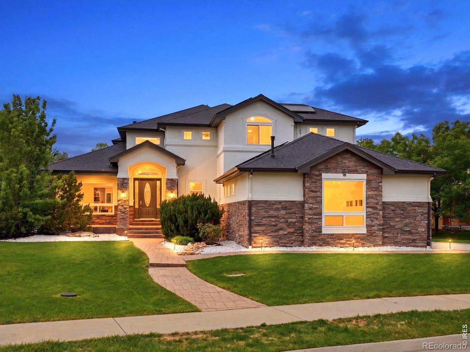 Welcome to 428 Meadow View Parkway where thoughtful design meets exceptional upgrades in Erie's coveted Candlelight Ridge. This 5-bedroom, 5-bathroom home has been extensively enhanced inside and out, offering a level of finish and functionality that's hard to replicate. At the heart of the home, the kitchen opens seamlessly to multiple living and dining spaces, designed for both everyday living and effortless entertaining. A dedicated office space, complete with French doors for privacy, allows for easy remote work. Upstairs, the primary suite is a true retreat, complete with a private balcony and two-sided fireplace that connects the bedroom to a spa-like bath with soaking tub, oversized shower, and abundant natural light. The suite is further elevated by a large custom walk-in closet with built-ins designed for both style and functionality. Two additional bedrooms share a Jack-and-Jill bath, and a guest bedroom with a private full bath completes the second floor. The finished basement expands your options with a wet bar, theater space, guest suite, convertible office space, and home gym. Step outside and you'll find a backyard designed for Colorado living at its best. A custom deck with outdoor kitchen, stone patio, pergola with firepit, and hot tub create a private, resort-style setting perfect for year-round enjoyment. What truly sets this home apart is the thoughtful care and investment made throughout. Enjoy brand-new windows, upgraded HVAC with air purification, new flooring throughout, a fully integrated smart home system, updated exterior finishes, and a fully finished three-car garage with hook-ups available for an RV. The addition of solar panels paired with Tesla Powerwalls brings both sustainability and energy independence. Located just a 4-minute walk to Longs Peak Park and minutes from shopping, dining, and everyday conveniences, this home offers the perfect balance of privacy, proximity, and elevated living, all within Boulder County.