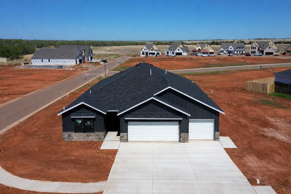 LIMITED INCENTIVE - Ask for details. The Clearwater floor plan is designed for modern living, blending style, comfort, and functionality at 4225 NW 180th Street in Deer Creek Community - Anthem. This open-concept home features a seamless flow between the kitchen, dining, and living areas, creating a spacious and inviting atmosphere perfect for entertaining or everyday life. The kitchen is a chef’s dream, boasting a large island, stainless appliances including a refreigerator, pantry, and ample cabinet space for effortless meal preparation and storage. Expansive windows and high ceilings fill the home with natural light, enhancing its warm and airy feel. The primary suite serves as a private retreat, featuring a luxurious en-suite bathroom with a double vanity, freestanding tub, a walk-in shower, and a spacious walk-in closet. Additional bedrooms provide versatility, ideal for guests, a home office, or growing families. Step outside to a covered patio and backyard space, perfect for relaxing evenings or weekend gatherings. With energy-efficient design elements, the Clearwater floor plan offers both style and sustainability, making it a standout choice in the new Anthem community. Anthem welcomes you with options that feel just right. Every detail has been carefully considered to create a move-in ready experience, including a fenced yard with gate, zoned irrigation system, tankless water heater, post-tension engineered foundation, and stylish white faux wood blinds throughout. Unmatched community amenities enhance daily living, featuring a resort-style pool, outdoor recreation area, basketball court, playground, and pickleball court. All just minutes from top-tier Deer Creek schools and with convenient access to Oklahoma City’s best shopping, dining, and entertainment.  Anthem offers the perfect setting for your next chapter. Corner Homesite. Estimated Completion May.  The photos are of a similar floor plan design with different finisheS. Welcome Home.