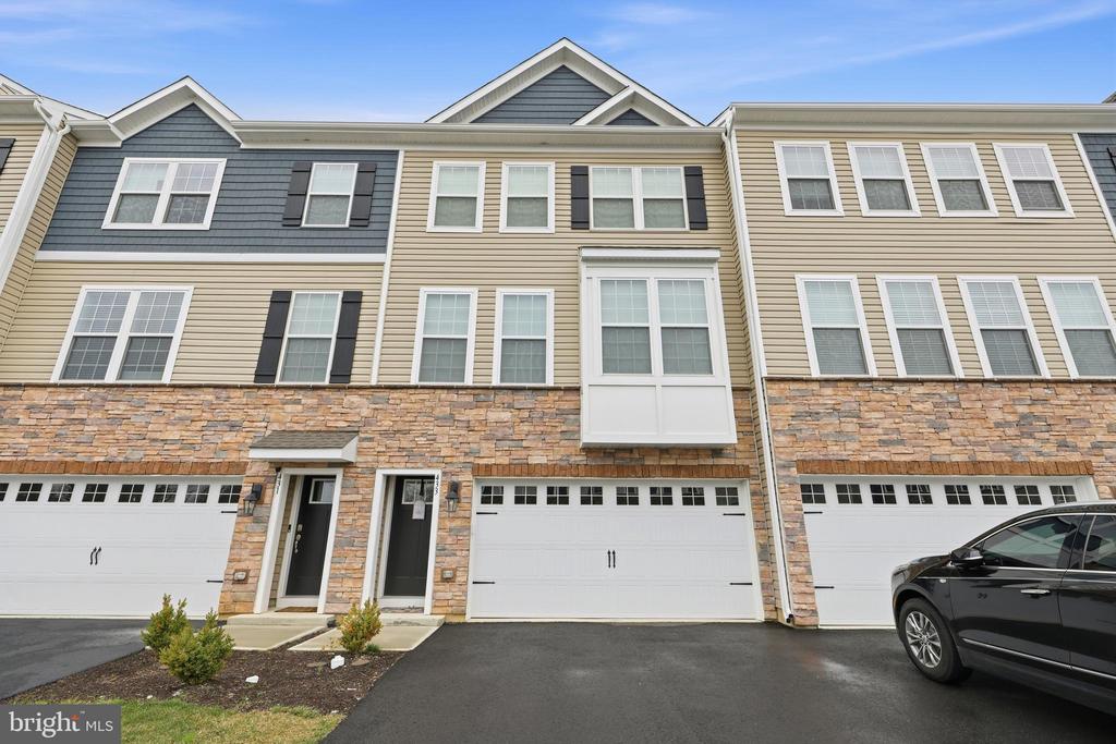 This open floor plan living meets the ease of a luxury townhome in the Atlas model by D.R. Horton, offering over 2,270 square feet of thoughtfully designed space in The Gables at Mt. Laurel. Ideally located just minutes from Routes 38, 73, and 70, with easy access to shopping and dining.The main level features 9-foot ceilings and a bright, open layout connecting the living, dining, and kitchen spaces—perfect for everyday living and entertaining. The kitchen is anchored by a large modern island with ample storage and workspace. Just off the dining area, enjoy a 12x10 composite deck—ideal for relaxing evenings and sunset views.Upstairs offers three well-sized bedrooms, a full hall bath, and the convenience of second-floor laundry. The primary suite includes a spacious walk-in closet and a private bath with a luxurious shower.The finished lower-level rec room provides flexible space for a home office, gym, or entertainment area.This home also includes D.R. Horton’s Smart Home System, featuring a Qolsys IQ Panel, Honeywell Z-Wave Thermostat, Amazon Echo Dot, SkyBell video doorbell, Eaton Z-Wave switch, and Kwikset smart lock.Exterior features include a professionally designed landscape package with front yard sod, trees, and shrubs.All-included features offer exceptional value.