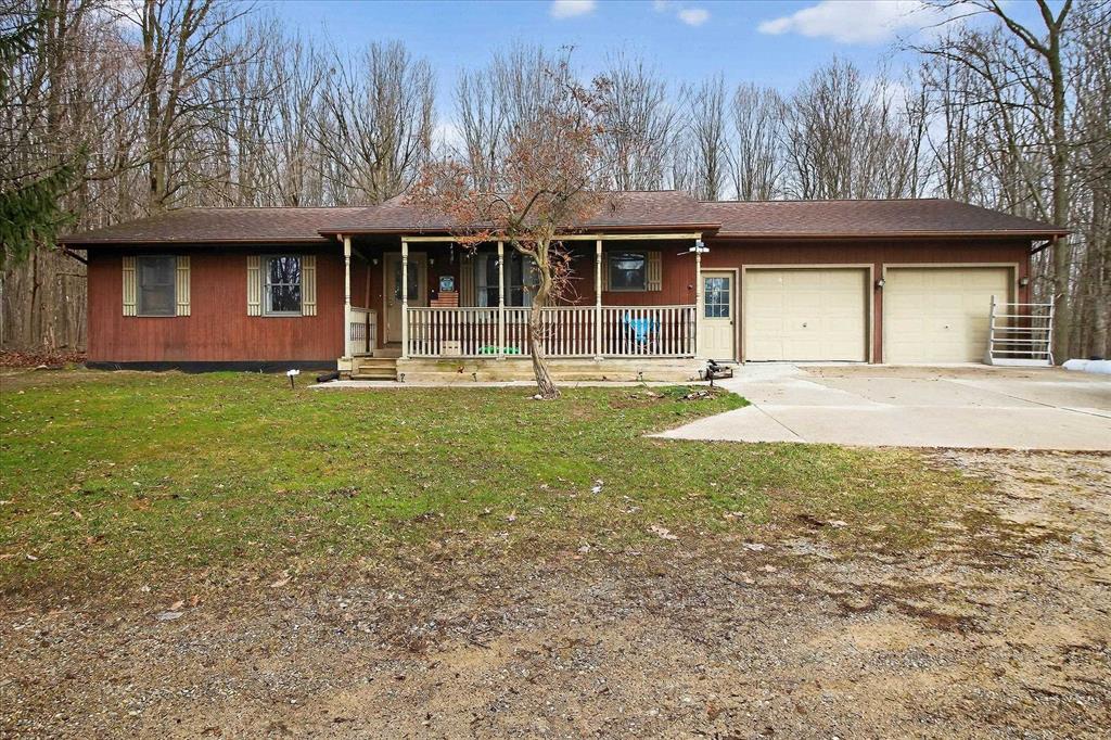 Country living couldn't get much better than this 5-bedroom 3 bath 1400 sq ft home on almost 6 partially wooded acres. Let's talk about peace and tranquility. This home sits almost 250 feet off the road. There are 3 bedrooms on the main level along with 2 bathrooms, Living room and kitchen. Bathrooms were remodeled in 2025 and some new flooring in 2024. New furnace in December 2024. In addition to 1400 sq ft of living space on the main level, there is 1400 sq ft of living space in the walk-out basement, including 2 bedrooms with egress windows waiting for your personal touch and additional 2 large rooms for storage and Laundry room with a full bathroom offering privacy and a separate retreat from the main living spaces. There is also a two-car attached garage and a frost-free hydrant in the yard just waiting to water your garden or wash your car and truck. Lets talk about the HUGE deck off the back of the house looking out into a wooded area, (beautiful) you want to party or just be able to sit out on the deck and enjoy mother nature, you won't find a larger, more inviting deck anywhere. This home is move-in ready and waiting for its next owner!