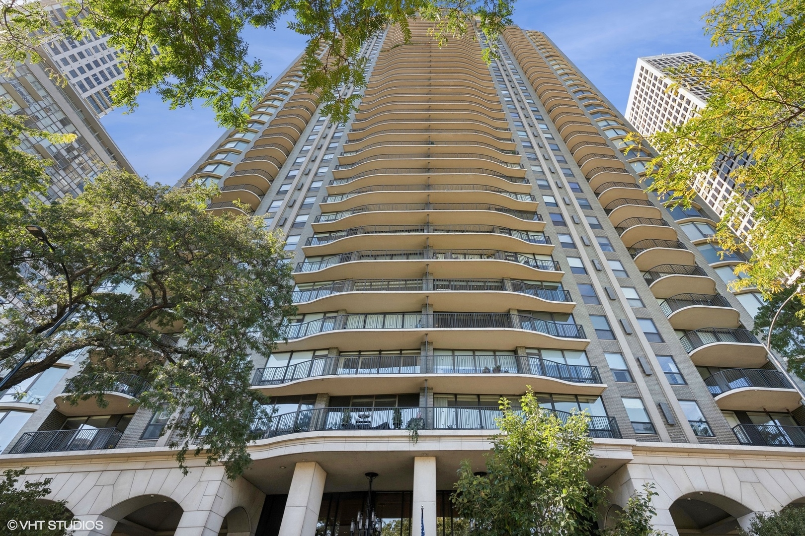 Situated in a prime location on Lake Shore Drive close to shopping, dining, and in between tree lined streets for those quiet residential walks, you'll find the Carlyle building. From its dramatic front steps to the private paver driveway in the back, this building features easy and luxe living at its best with parking included. You'll step off the elevator into an intimate marble foyer and lovely unit with gracious entryway, detailed up-lit tray ceilings and two coat closets. This unique B layout is a perfect size with a floor plan that flows, large living room and formal dining room with picture perfect views of the lake, Oak Street Beach, Lakefront Park, and cityscape. Enjoy the fresh air and views from both East and West facing terraces. This unit was completely renovated in 2016 including a reconfigured layout, new kitchen and baths, floors, updated plumbing and electricity and all new windows and patio doors. Chic and classic white kitchen features a Thermador double oven, cooktop and warming drawer, U-line beverage fridge, butlers pantry with wet bar, washer/dryer and walk-in pantry for additional storage. Large primary bedroom suite has a private terrace, bathroom with double bowl vanity, steam shower, linen cabinets, and huge custom walk-in closet. Second bedroom has a custom closet and sunny and city views to the West. Throughout the unit you'll find quality finishes including upgraded moldings, baseboards, paneled doors, high-end hardware, solar shades and drapes, zoned heating and cooling. Move-in ready unit that checks all the boxes of view, outdoor space, parking and wonderful Gold Coast location! 24 hr staff, indoor rooftop pool, wrap around roof deck with grills and seating, gym and hotel ballroom like party room with a catering kitchen for those over-the-top parties overlooking the lake.