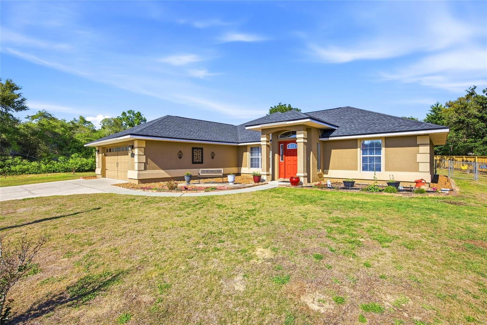 Welcome to this stunning and well-maintained home nestled on a desirable location in Ocala Waterway Estates!! This concrete block and stucco split-plan home offers 3 bedrooms, 2 baths, and a 2-car attached garage sitting on a .51 acre chain link fenced lot with no HOA restrictions. Step inside to a versatile layout which includes both a formal living room and a family room. The heart of the home features a huge kitchen with ample counter and cabinet space, perfect for the home chef and for entertaining guests. A sliding doors opens to the expansive tiled and screened Lanai with access to the backyard.  Recent updates new roof 2025, AC 2016. Also includes a storage shed. This beautiful home offers generous layout ideal for those who love to host. Located just 7 minutes from Publix, local shopping centers, medical offices, restaurants, and Highway 200 and more. Scheduled your private showing today!