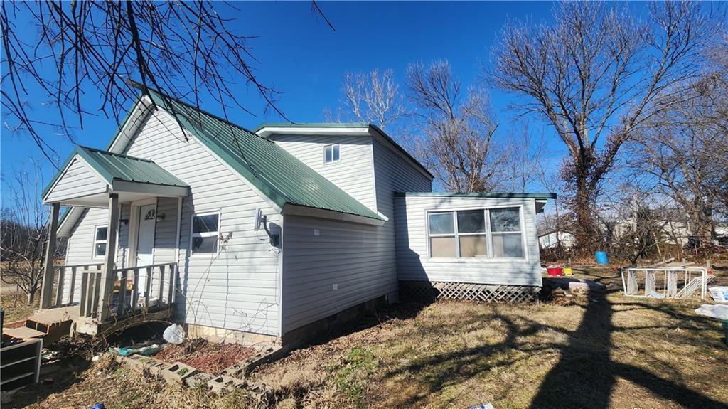 Affordable 3-bed, 1-bath home on two nice lots just outside town! Built in 1995 with vinyl siding, a metal roof, and central heat and air already in place. Bring your vision and make this property shine—an excellent opportunity at a great price.