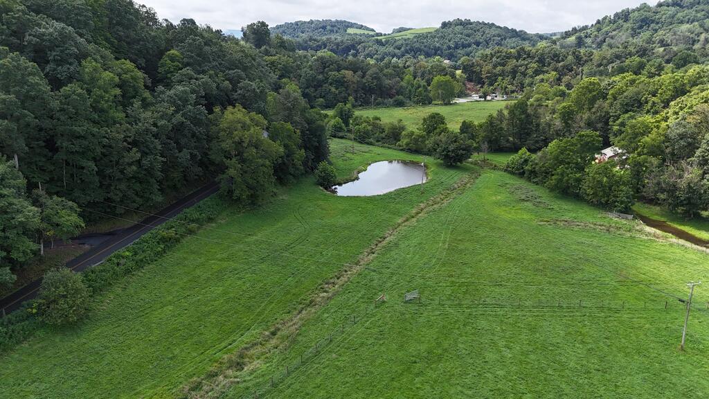 Discover the perfect blend of space, location, and opportunity with this exceptional 6.9-acre property, ideally situated within walking distance of beautiful Hungry Mother State Park. If you've been searching for the ideal place to build your dream farm, equestrian property, or private country retreat, your search may finally be over. The level acreage offers plenty of room for your vision, complete with creek frontage and a stocked pond. The property has been newly fenced and is ready for horses, cattle, or other livestock. A large barn provides abundant space for equipment, storage, livestock, and more. Barn has a total of 4280 sq ft under roof with its generous size and lighting already installed, the barn even offers the potential for an indoor riding or training arena—perfect for enjoying your horses year-round, regardless of the weather. Imagine having room to roam, water features right on your property, a large barn ready for your needs, and the convenience of Hungry Mother State Park just a short walk away. This rare combination of acreage, usable land, recreational access, and livestock-ready improvements is an opportunity you simply don't want to miss. Whether you're looking to establish your own homestead, create an equestrian haven, raise livestock, or simply enjoy the peace and freedom that comes with owning acreage, this property is ready to make your vision a reality. If you've been waiting for the ideal location and the ideal property, wait no longer. Opportunities like this don't come along often. Make your move before someone else does!