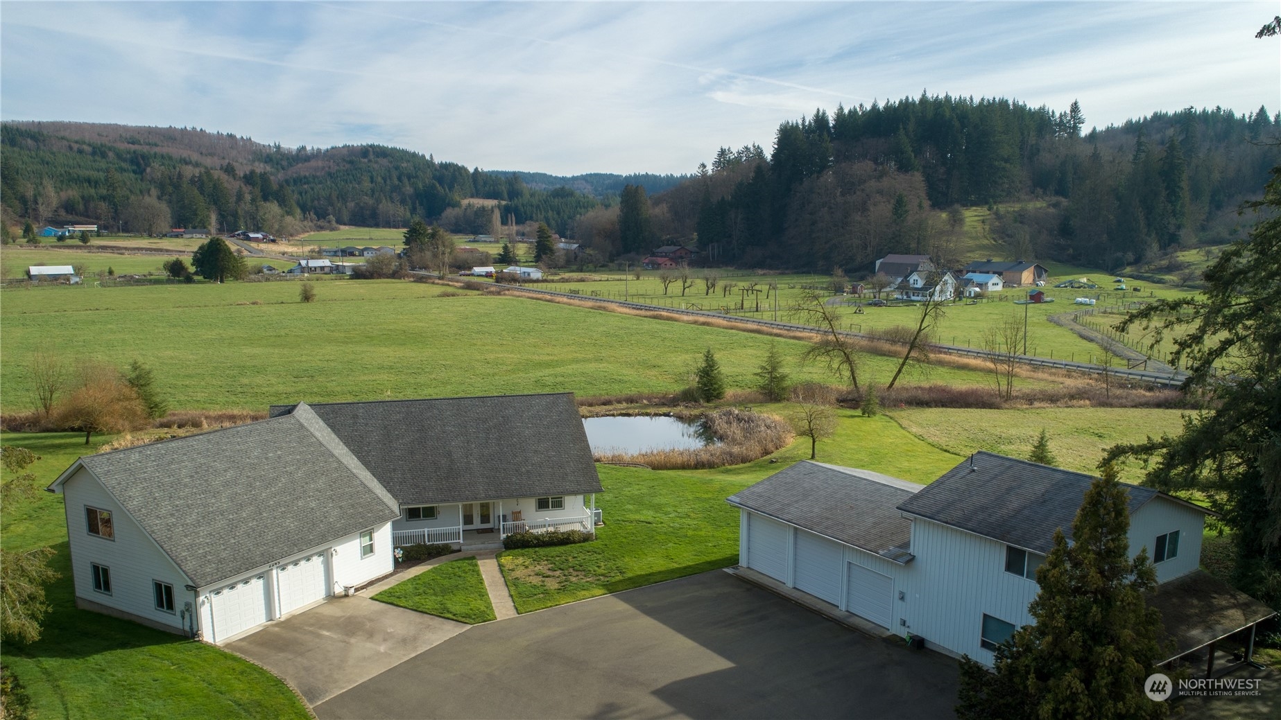 Improved price for a spring closing to accommodate seller relocation before summer!  Multifamily 2626 square foot custom home - 2 bedroom guest/rental house - original log homestead covered over with siding - fabulous valley views overlooking a sweet fishing pond, you'll find the property has it all - a shop with Benpak 10,000 lb auto lift - built in compressor  - 7 car parking - paved driveway - marketable timber on hillside - hay fields - orchard & finally, Salzer Creek singing through the property.  The original Salzer family homestead house is no longer a residence, but is great canning or crafting space for projects we all wish we had extra space for. Current photos & older photos attached - Call for your private tour today!