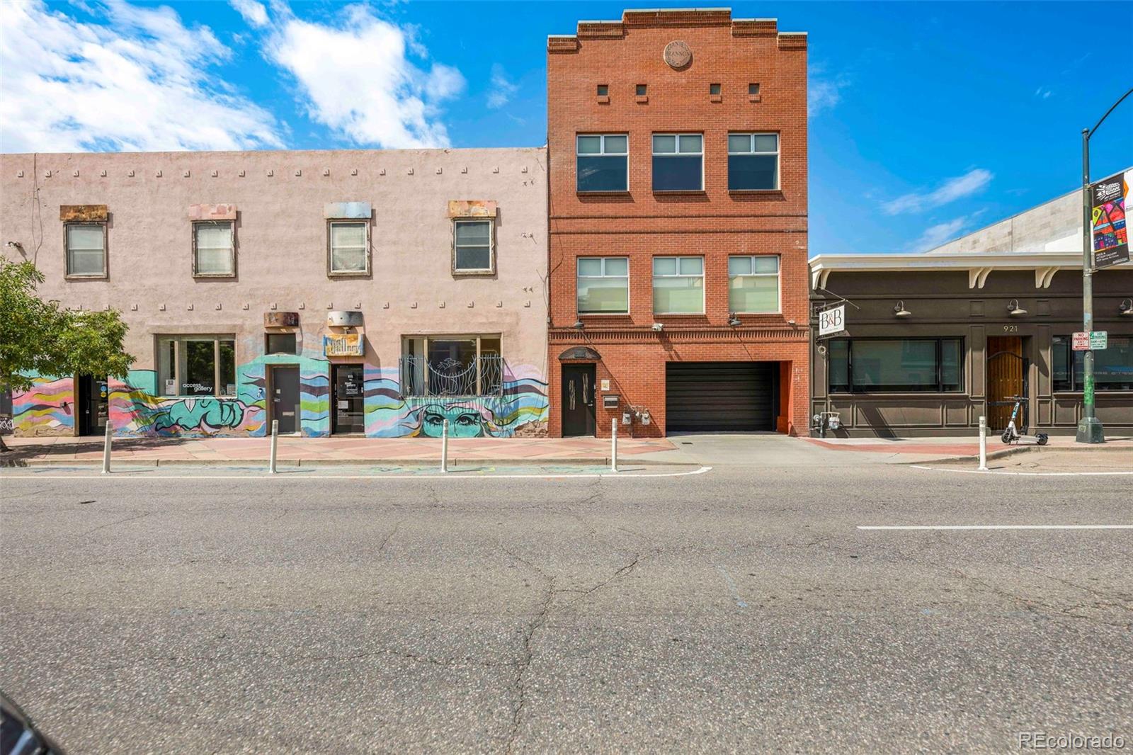 Iconic Live/Work Loft in the vibrant Santa Fe Arts District | Rooftop Oasis & Designer Finishes Experience artful living in one of Denver’s most distinctive properties, positioned in the heart of the Santa Fe Arts District. This architectural showpiece blends creative workspace and luxurious residential comfort across over 5,000 sqft of total space. This includes a spectacular 500 sqft rooftop deck with sweeping city & mountain views. The top 1,928 sq ft floor unfolds with soaring arched ceilings, warm natural light, & seamless flow to a balcony off the chef’s kitchen. Every finish has been carefully curated; from granite countertops & a professional gas range to dual wine refrigerators, a warming drawer, & bespoke cabinetry. The spa-inspired bath offers a rejuvenating retreat with dual rainfall showerheads & body jets. The rooftop deck transforms daily life into an event: dine al fresco, enjoy panoramic sunsets, & use the dumbwaiter from the patio to send up cocktails or dinner for effortless entertaining. Below, the 1,560 sq ft of modern flex-space delivers the ideal setup for a true live/work lifestyle. This is perfect for artists, entrepreneurs, or remote professionals seeking a creative edge! Every month, the street transforms into a lively festival of artists, musicians, performers, food trucks, & local vendors. Enjoy live music, martial arts demonstrations, & pure creative energy from the comfort of your window or by stepping into the heart of Denver’s most beloved cultural event: Santa Fe District’s First Friday Art Walk! Separate electric meters, independent HVAC, & secured entrances allow each level to function on its own, creating real income potential. Two covered parking spaces, additional storage, & no HOA complete this rare opportunity. An entertainer’s dream and a creative’s sanctuary. All in the vibrant core of 80204! *The digital furnishings shown in photos are for inspiration only. The home is currently vacant and ready for your personal vision!*