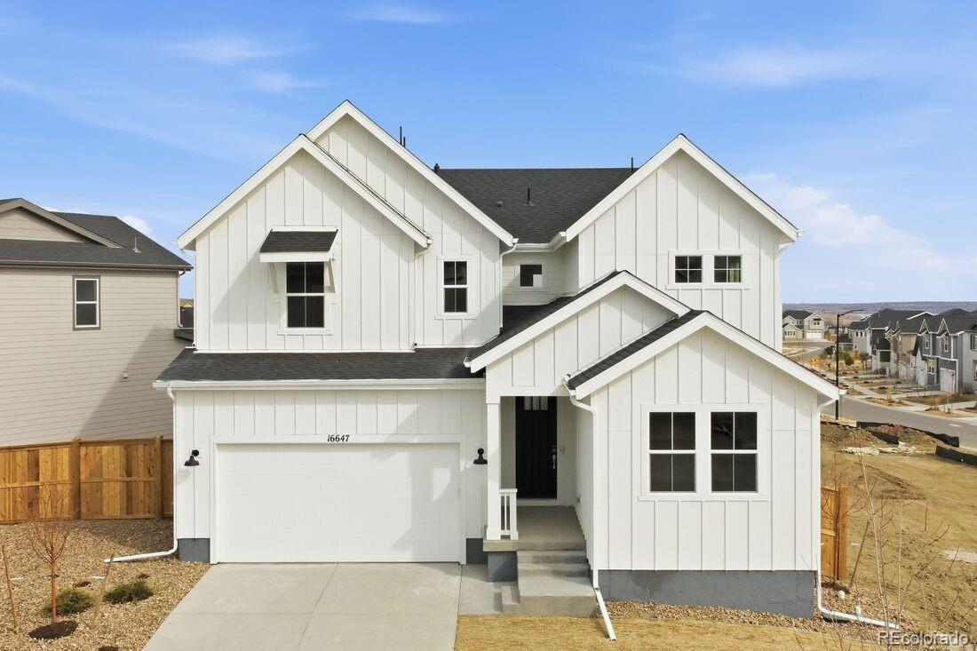 What's Special:  Multi-Gen Suite | Covered Patio | Tub in Primary Bath. New Construction - Ready Now! Built by America's Most Trusted Home Builder.Welcome to the Fairmount at 16647 W 92nd Place in Trailstone City Collection! Meet the Fairmount—a spacious two-story home designed for comfort and connection. The heart of the home is the chef-inspired kitchen with abundant cabinetry, a large island, and walk-in pantry, flowing into the dining area and dramatic two-story great room. Step outside to a covered patio and soak in Colorado sunshine. The first floor also offers a private multi-generational suite with its own living area, kitchenette, full bath, laundry, and bedroom. Upstairs, the serene primary suite features a spa-like bath and walk-in closet, while three additional bedrooms share a full bath. A loft and second laundry room add everyday ease. Discover Trailstone in Arvada, CO—where Rocky Mountain views meet modern living. Enjoy spacious backyards, an outdoor pool, and pickleball courts, all just 15 miles from Boulder. Every day is an opportunity to explore and unwind in this stunning community. Additional Highlights Include: 9' garden level basement, 42" modern fireplace, interior doors at multi-gen suite, door at primary bath, freestanding tub at primary bath, additional sink at bath 2, and covered outdoor living. MLS#9111779