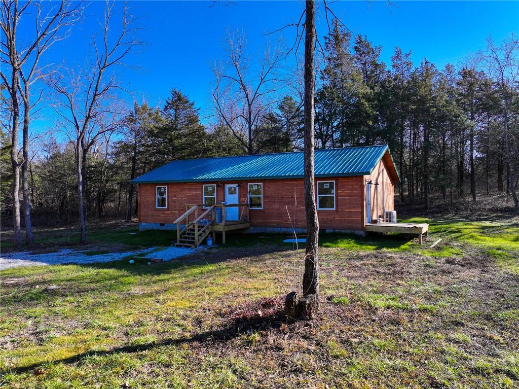 House for sale Collins Missouri Discover your private retreat in the heart of the Midwest. Sitting on approximately 3+/- acres of serene, wooded land (survey in process), this newly built 1,200 sq ft home in Collins, Missouri offers the perfect blend of rustic charm and modern efficiency. Tucked away just off Highway 54, this thoughtfully designed residence features a warm, inviting layout with two generously sized bedrooms and two full bathrooms. The living space is enhanced by rustic finishes that echo the tranquility of the surrounding landscape. Built for comfort and sustainability, the home is efficiently heated and cooled by mini-split systems, keeping utility costs low year-round. It also includes a private septic system and shares a well with only one neighboring property—providing both independence and reliability. Land for sale St. Clair County Missouri The property also features a spacious 30x40 shop, complete with partial living quarters—offering incredible potential for guest accommodations, a hobby workspace, garden prep area, fish-cleaning station, or anything else your imagination can dream up. Whether you're envisioning a hobby farm, a hunting retreat, or a full-time rustic escape, this property is ready to bring your vision to life.Conveniently located in Collins, Missouri, you're just a short drive from Bolivar, where you'll find essential amenities including a hospital, grocery stores, and dining options. For even more access, Springfield is just an hour away, and Kansas City is about 90 minutes.Outdoor enthusiasts will love the proximity to Truman Lake and Pomme de Terre Lake, both offering excellent fishing, boating, and camping opportunities. Plus, with thousands of acres of nearby Corps of Engineers land, you'll have no shortage of space for hunting, hiking, and exploring.