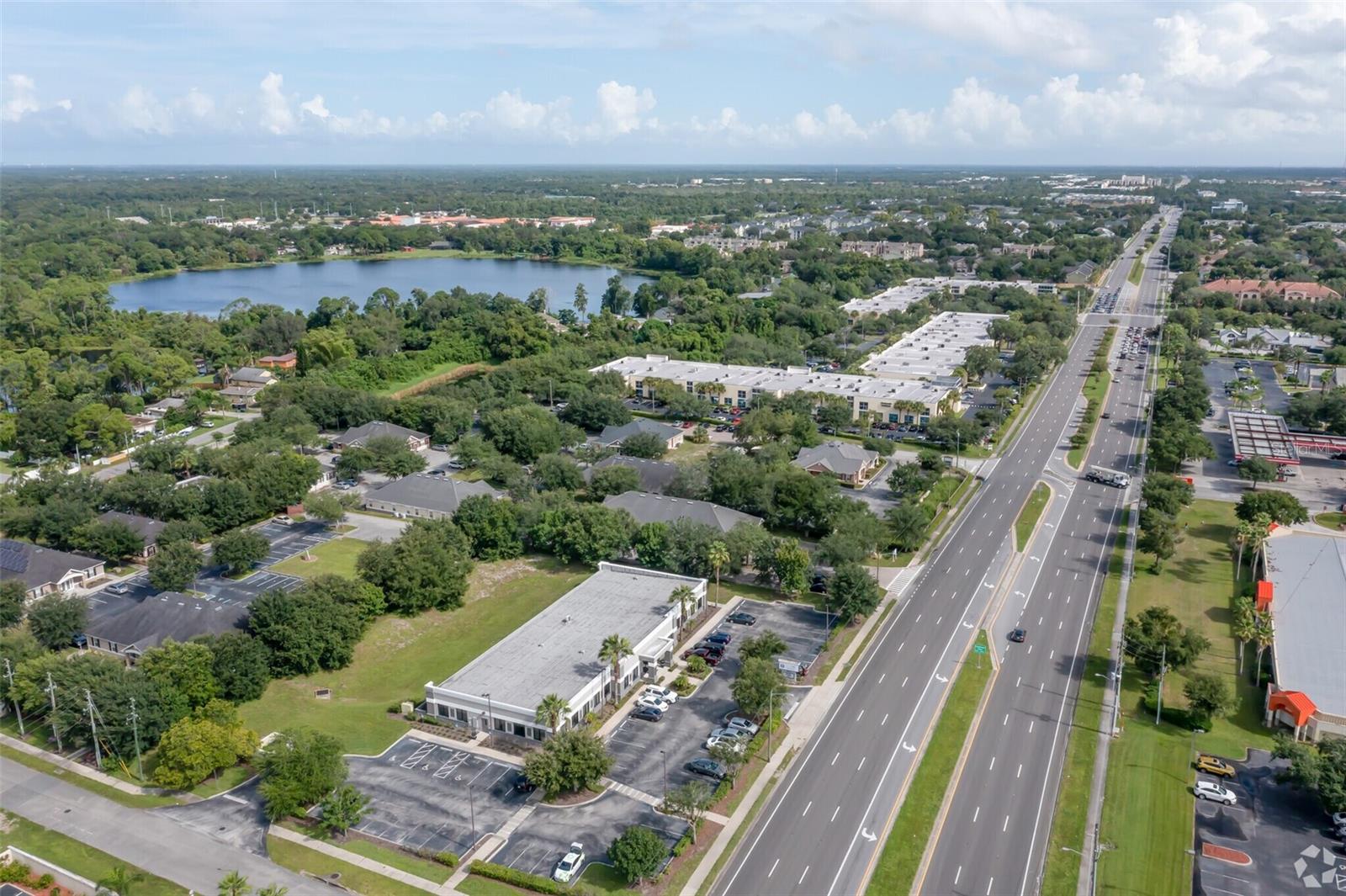 Premium standalone commercial building in the heart of East Orlando—strategically located on high-traffic Alafaya Trail with visibility to over 42,000 vehicles daily. Just 1 mile from the University of Central Florida, one of the largest universities in the country, this property offers direct access to a dynamic population of students, faculty, research professionals, and supporting businesses.

Boasting over 11,500 SF of fully renovated interior space, the building features approximately 50 individual office suites, multiple conference rooms, and well-appointed shared areas including a kitchen, coffee lounge, and reception spaces—all thoughtfully designed for productivity and comfort.

A brand-new roof and paid-off solar panels (to convey at closing) offer long-term energy efficiency and reduced operating costs. With ample on-site parking, monument signage, and strong street presence, this is a rare opportunity to own a signature asset in a thriving economic corridor.

Whether you're seeking a flagship location or an income-generating investment, this property checks every box.