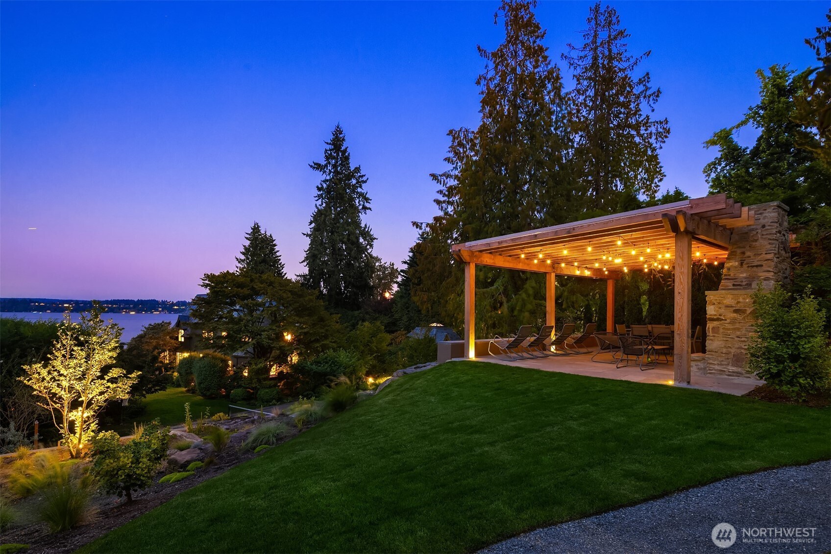 One of Seattle’s greatest waterfront opportunities awaits on the Gold Coast of Lake Washington. Whimsical charm meets modern elegance, all on 1.6± acres of park-like grounds and 153± ft of waterfront. The main residence is a Tudor-inspired architectural jewel with slate roof tiles from Italy, original crown-molding, and meticulous attention to every detail. Enjoy easy indoor-outdoor flow, with multiple sets of French doors beckoning the outdoors in. This distinguished property boasts the best of modern luxury: guest house (901 sq ft with office and guest suite), private dock with boat lift, entertaining pavilion & sports court. Calling all art lovers, garden enthusiasts, entertainers, & more! One of the best properties the PNW has to offer.