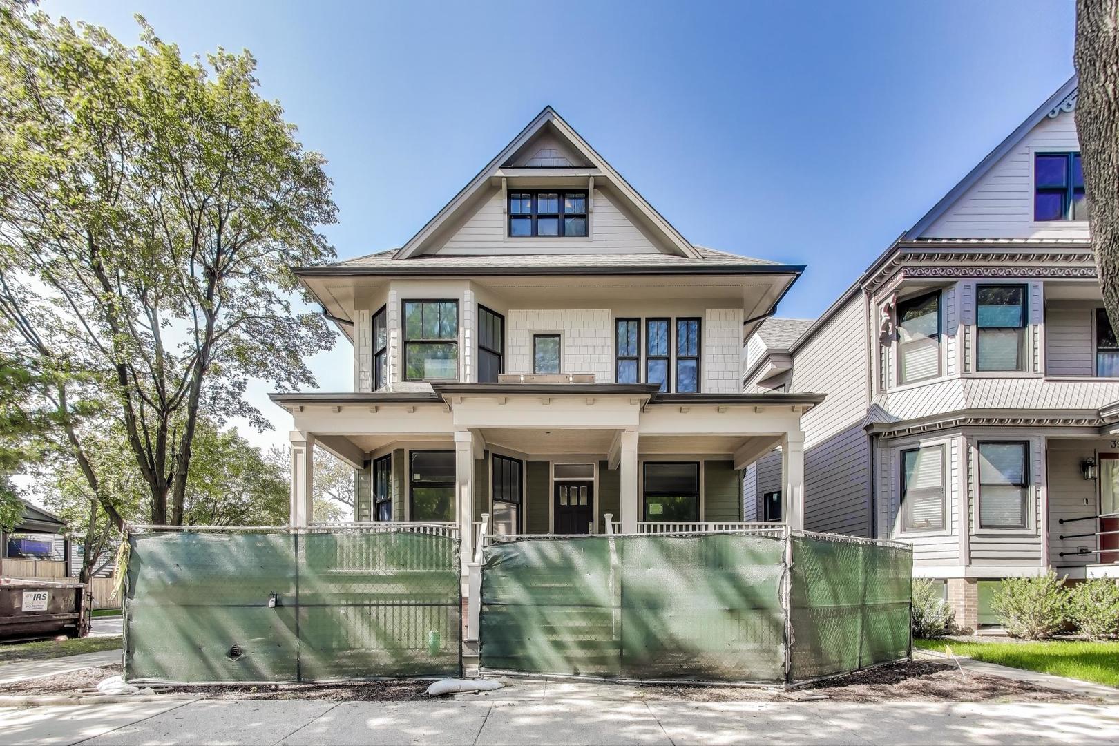 If you're bored and uninspired by the same house/different block/bland new construction, we will rock your world!   On a 41'x124' corner lot with nearly 6,000sf, Bloom Properties has meticulously restored and creatively transformed this circa 1905, 3-story North Center home, in Bell Elementary.  Every element of the home is custom. The show-stopping exterior design in sage, cobblestone and taupe includes a wide, deep front porch overlooking the beautiful tree-lined streets.  Enormous landscaped front/side and rear yards are sprinkler-ready and will include a custom alfresco kitchen under a cedar pergola.  EV ready garage is 1-1/2 stories with walk-up to enormous storage.  Inside, every room is filled with light and joy.   Luxuriously custom stained red oak floors paired with a Farrow & Ball paint palette create serene space.  The custom staircase winds gently to all 4 floors.  Six of the seven bedrooms are up - 2 ensuite.  The spectacular custom kitchen with Wolf/SubZero/Cove professional appliances, walk-in and butler's pantries, opens to a great room with floor to ceiling walnut and limestone fireplace.  Custom tile work, millwork, 8-foot, 3-panel solid core doors with transoms and Baldwin Reserve hardware, plus custom built-ins and cabinetry, throughout.  Restored art glass and imaginative reuse of the home's original features finish the rooms.  Two laundry rooms - one with a dog spa!  Heated floors at rear entrances, in every bathroom and of course the full lower level.  No detail overlooked.  Built by a dedicated team of exceptional craftsmen who take the project from start to finish.  Only Bloom Properties takes the time and commits the resources to restore and reimagine Chicago's vintage and historic homes. * * * Some details, finishes still to be specified by builder.  Late October delivery.