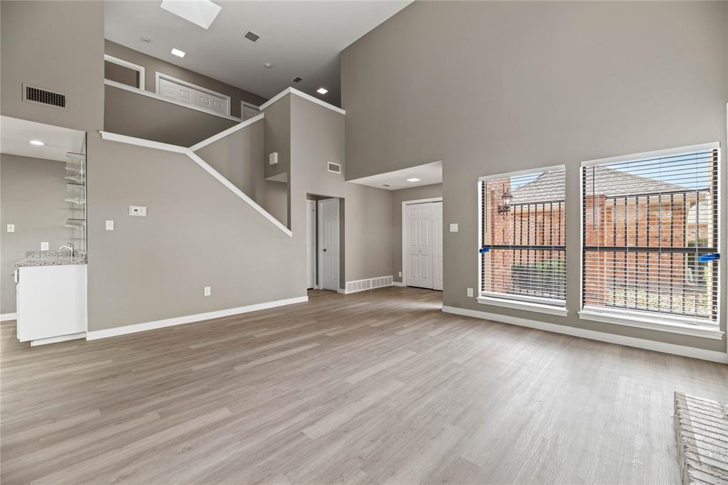 Step into modern comfort and style in this beautifully updated 2 bedroom, 2.5 bath townhouse in the sought after Meadows West community. Light pours through soaring ceilings, creating a spacious, inviting atmosphere that welcomes you home.

The open-concept living area features built-in shelves for your personal touches and a cozy wood-burning fireplace, perfect for gathering on cool evenings. The updated kitchen is a chef’s dream with granite countertops, stainless steel appliances, a double oven, a cooktop, and a versatile island, plus a wet bar for easy entertaining. Step right outside to your private back patio and enjoy morning coffee or evening cocktails in your own slice of outdoor heaven.

The primary suite offers a serene escape with its private balcony, dual vanities, soaking tub, and separate shower, a perfect way to unwind after a long day. A versatile loft upstairs gives you options: a home office, gym, or reading nook.

This home also offers a 2-car attached garage with plenty of space for storage and parking. With modern updates, thoughtful details, and a layout that balances style with functionality, this townhouse is ready to welcome you home.